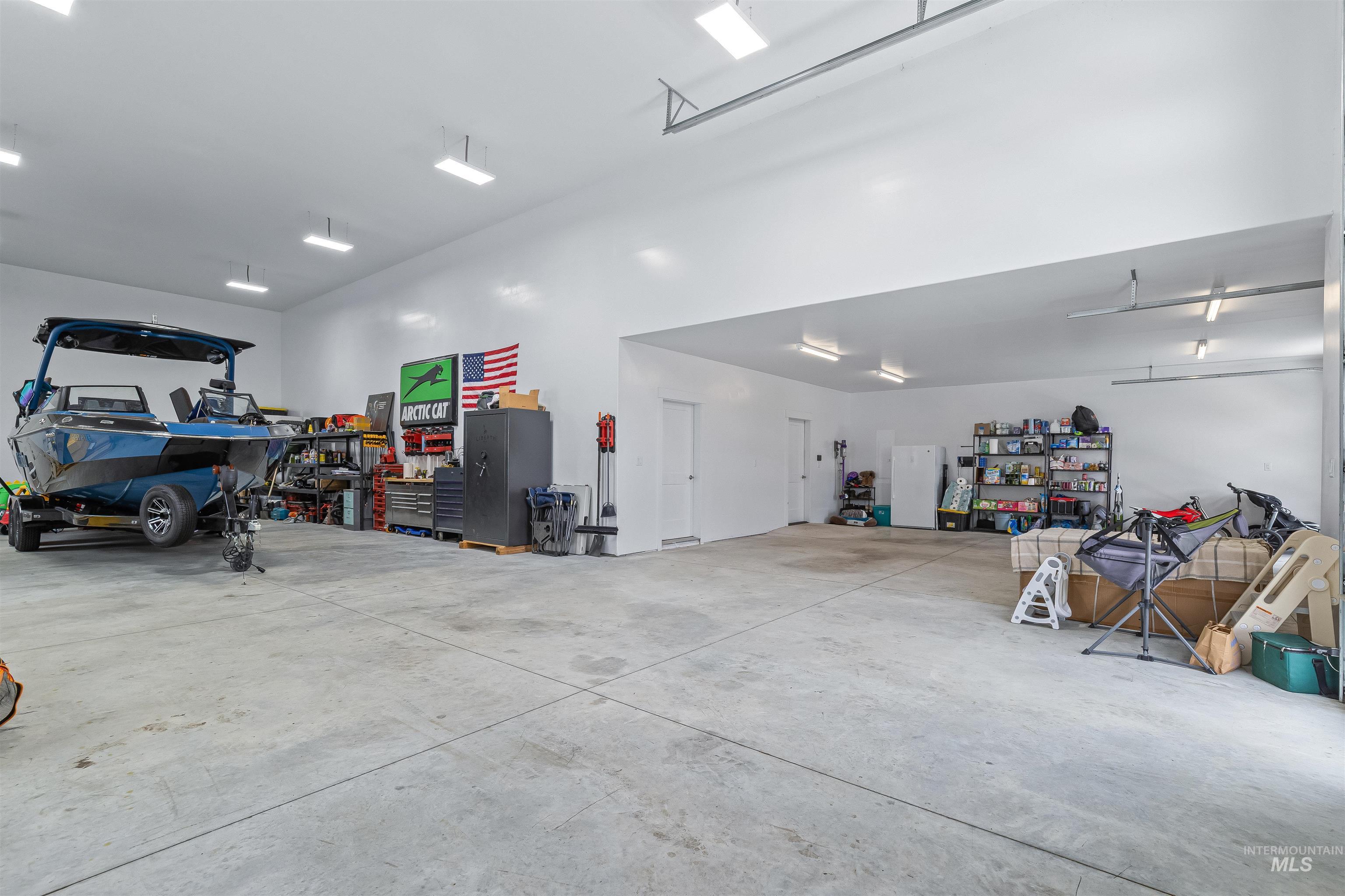 Garage featuring freestanding refrigerator