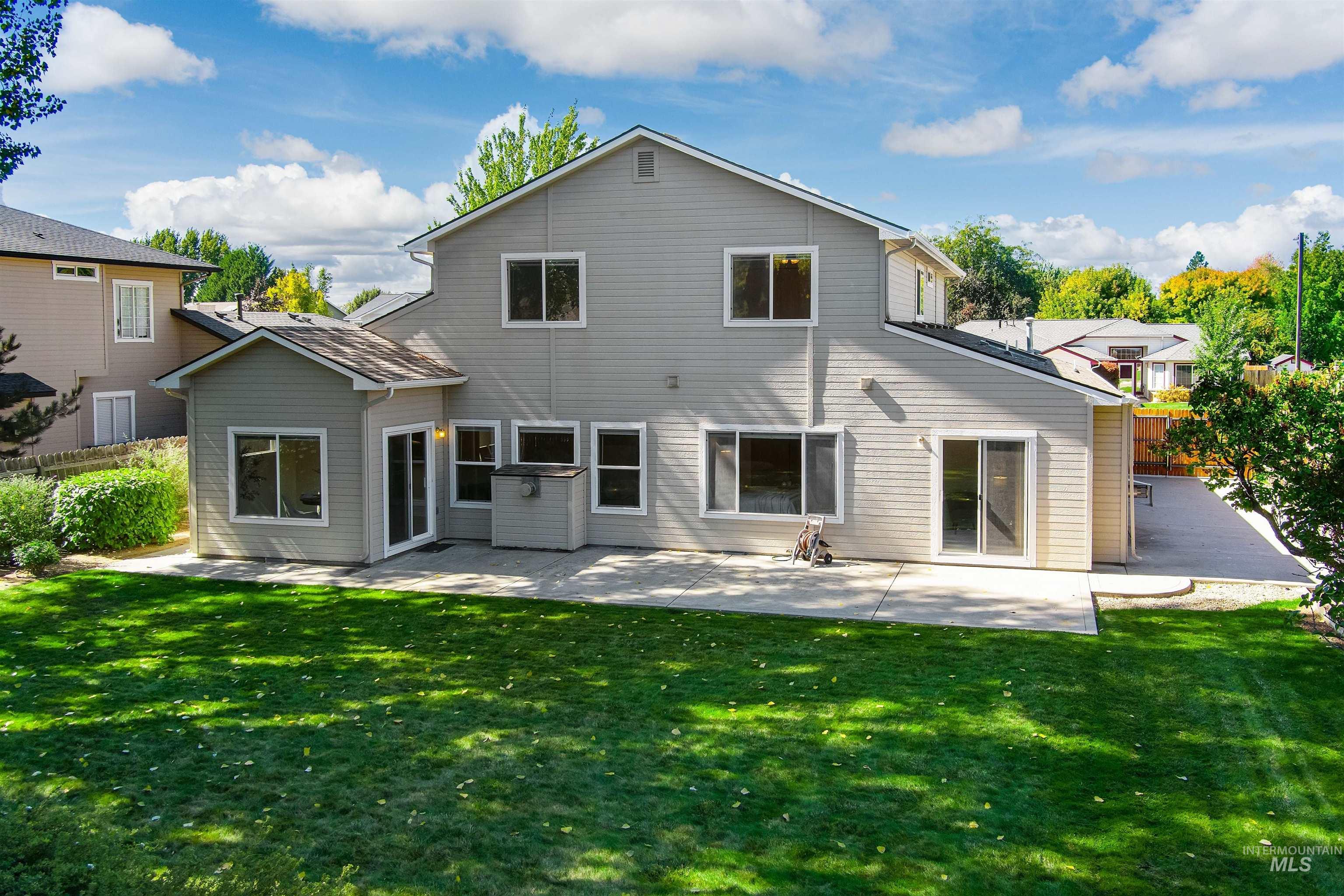 Rear view of property featuring a patio