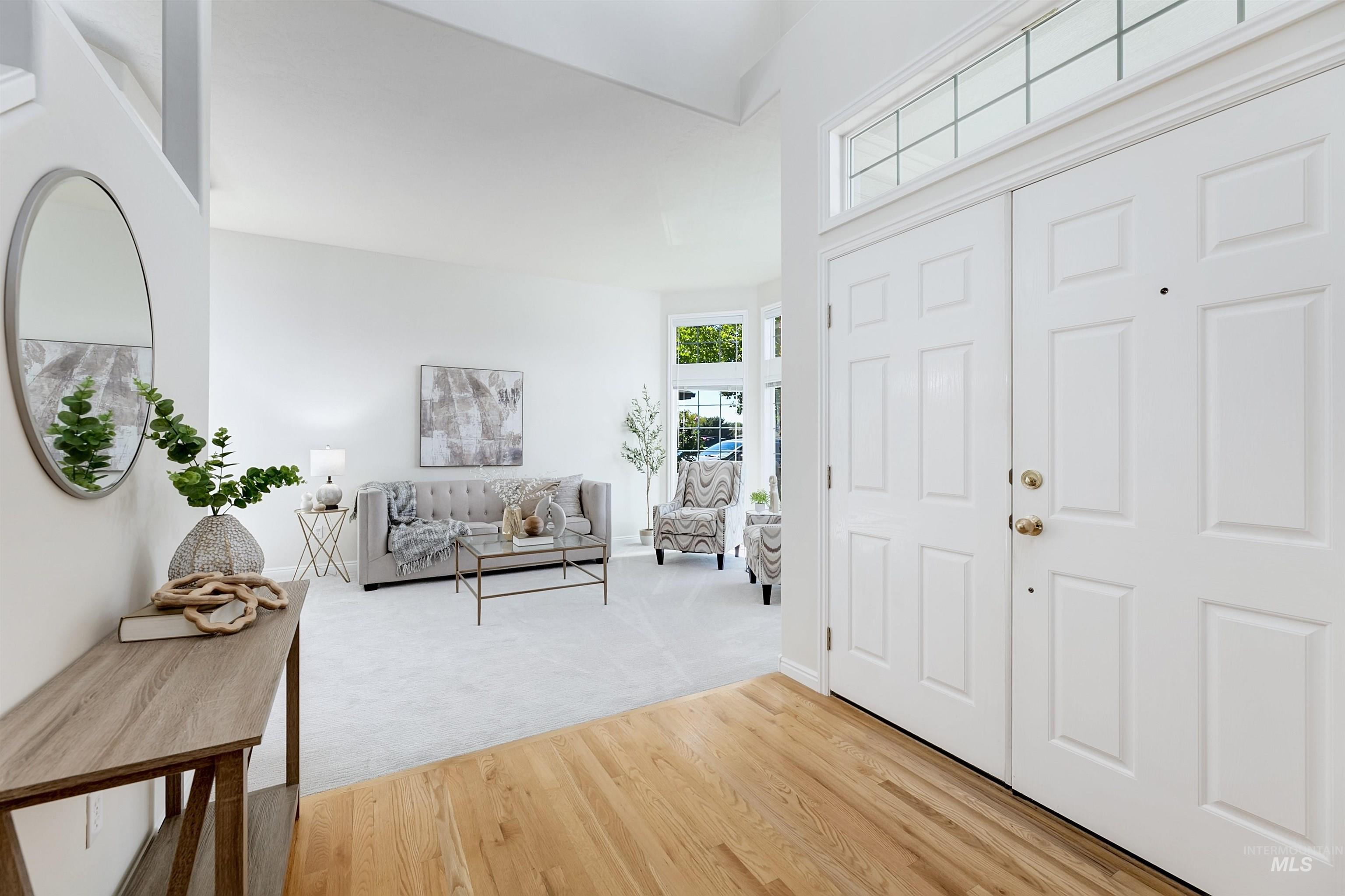 Foyer entrance featuring light wood-style floors