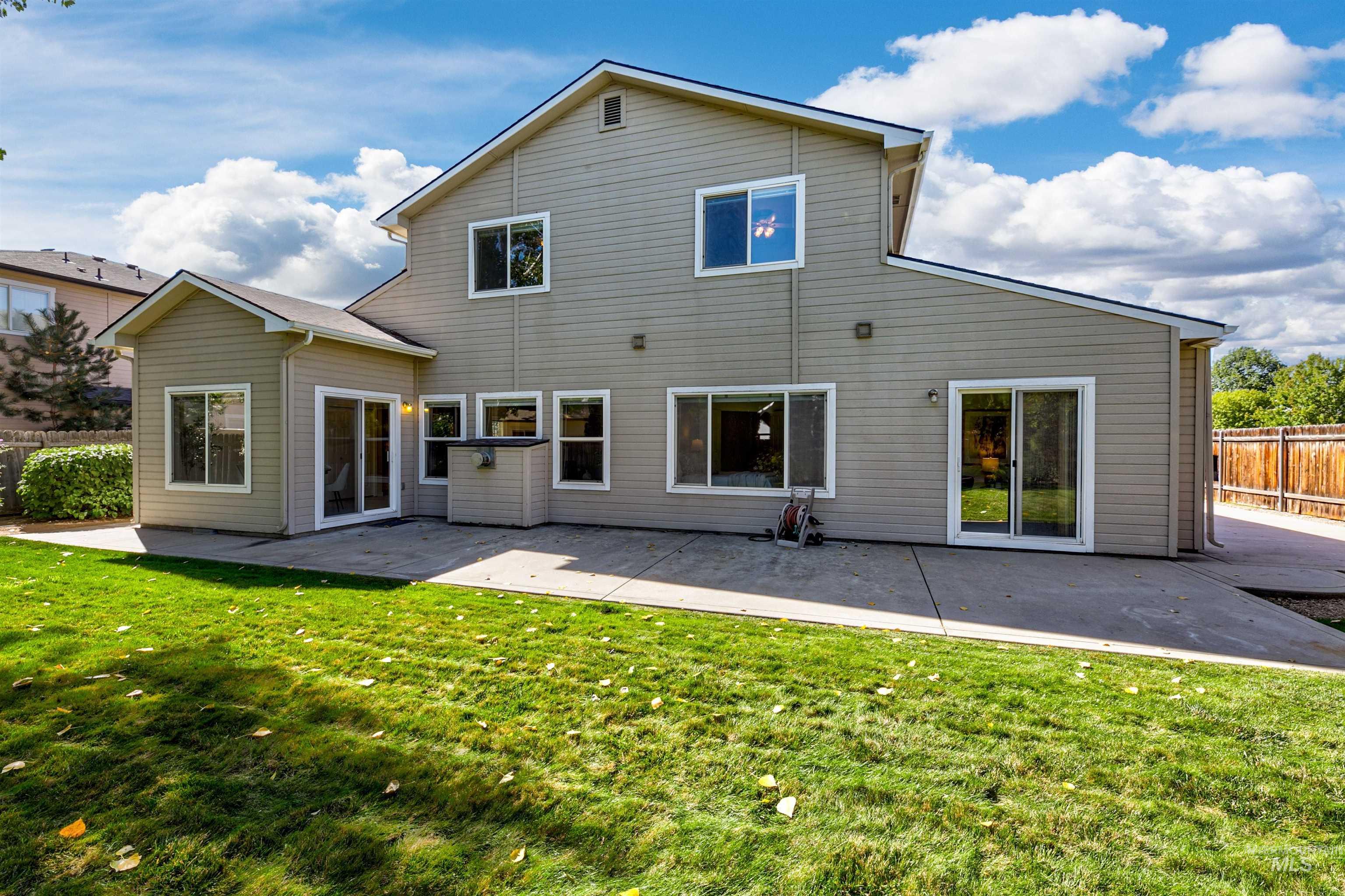 Back of property with a patio area