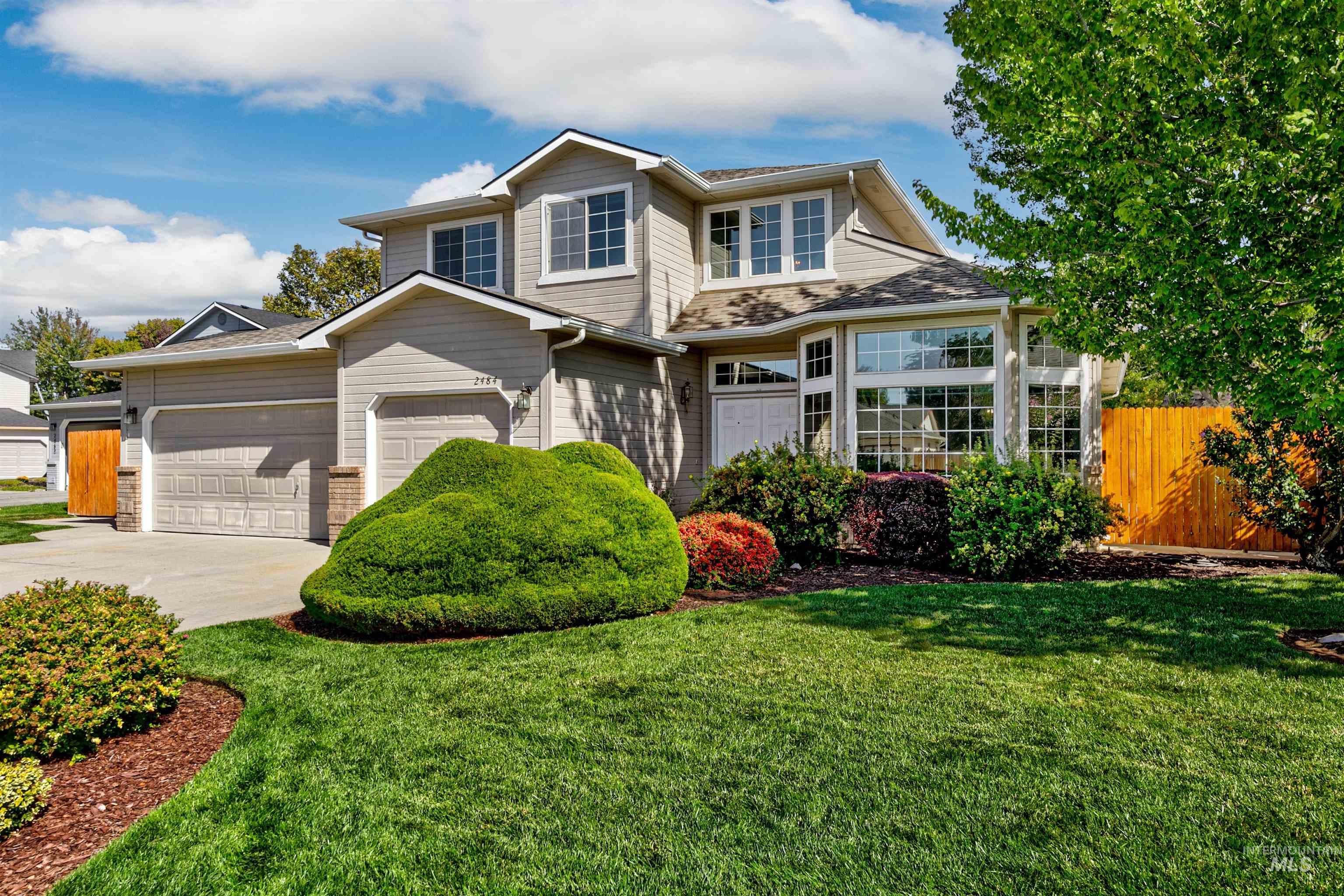 Traditional-style home with concrete driveway