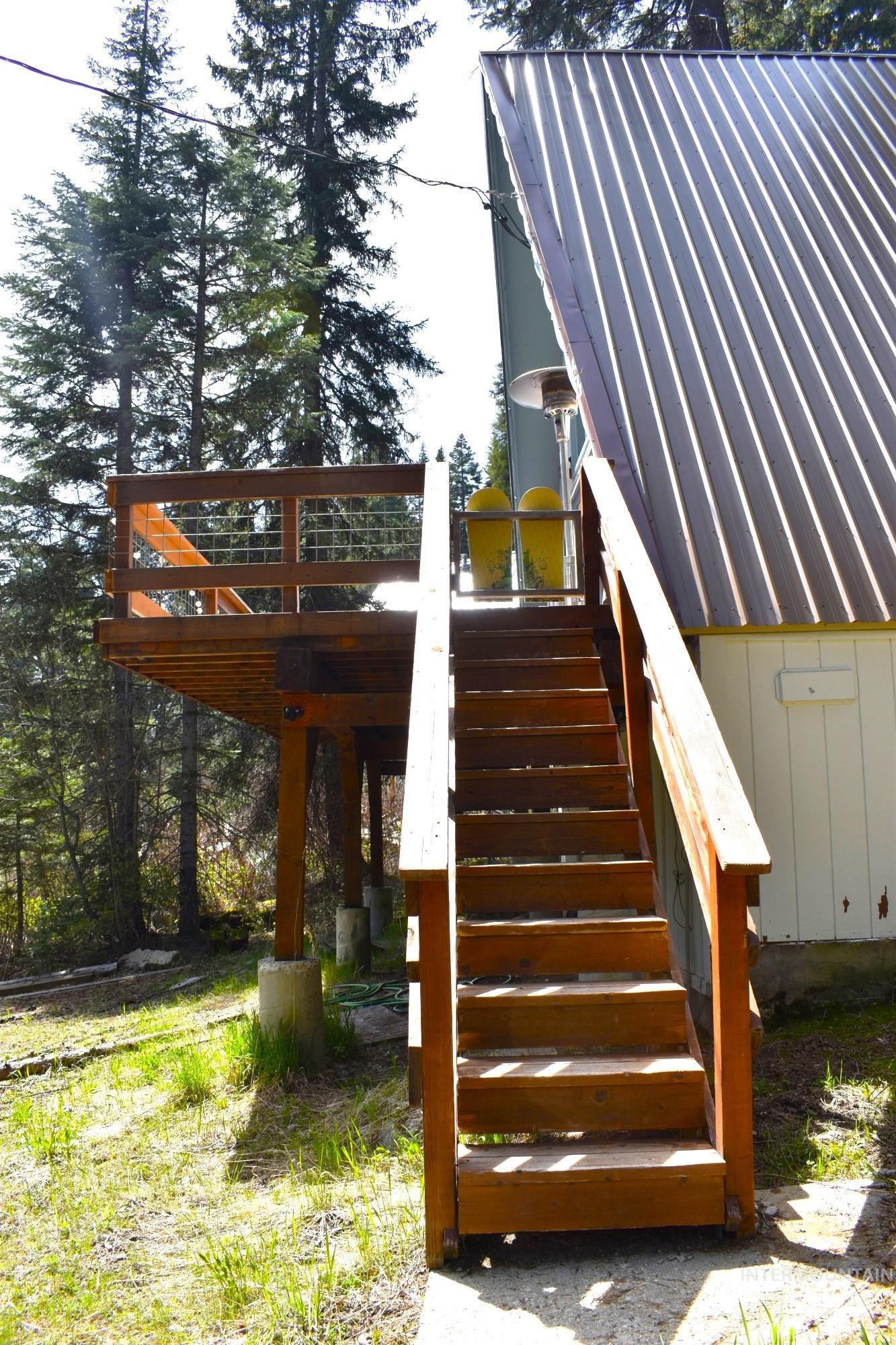 Expansive wood-finish deck with cable railing