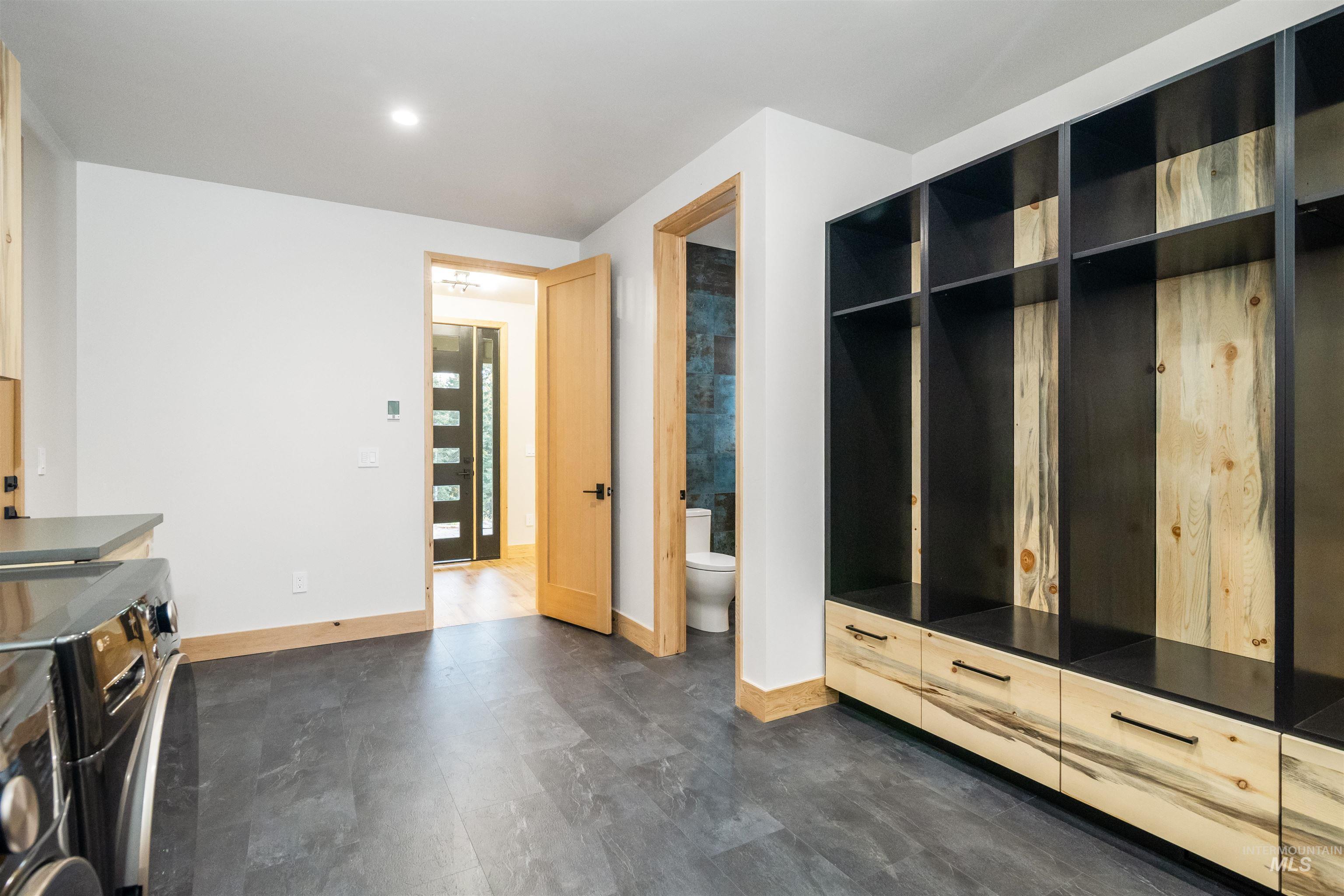 Mudroom featuring separate washer and dryer and recessed lighting