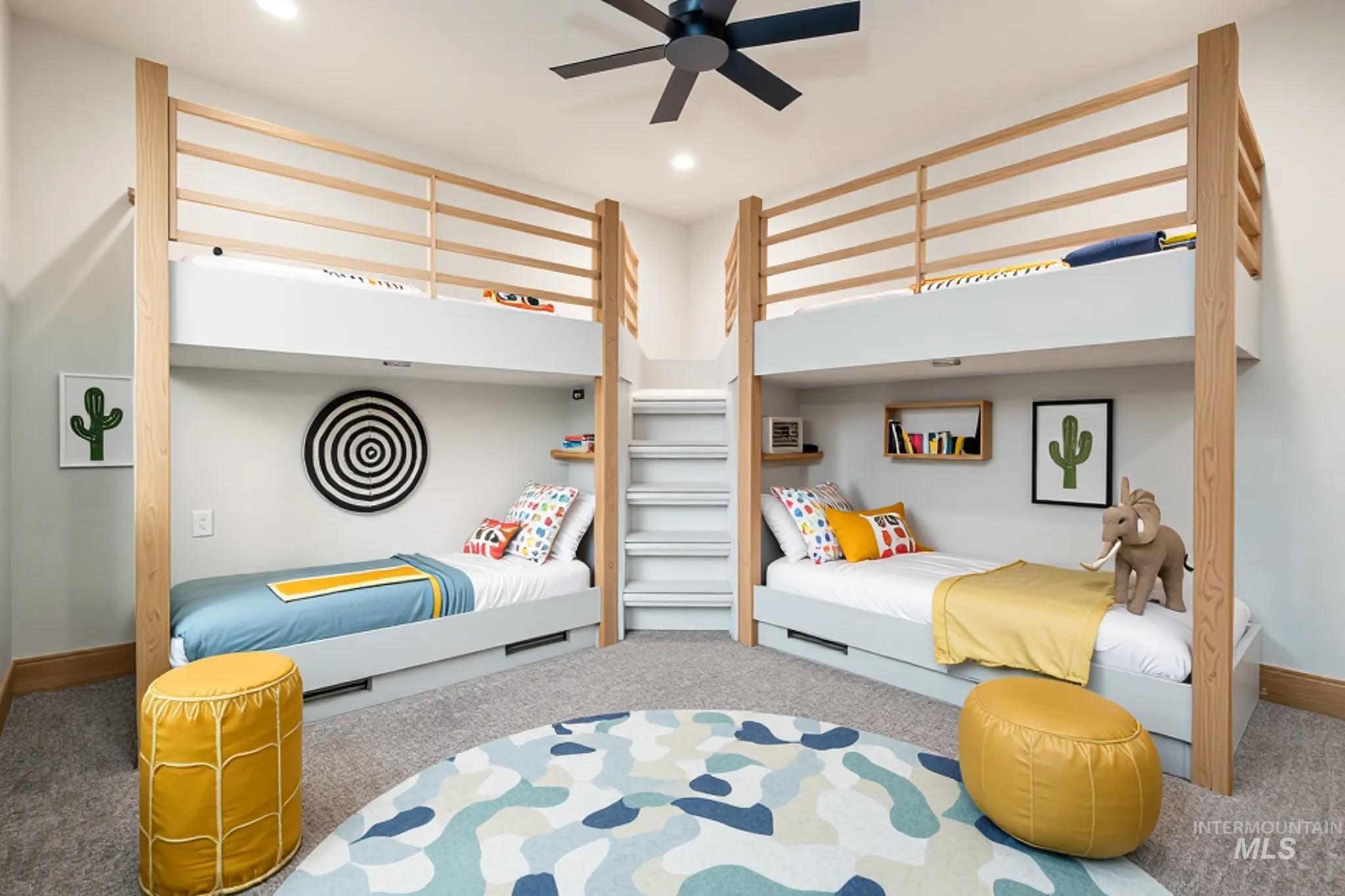 Carpeted bedroom with ceiling fan and recessed lighting