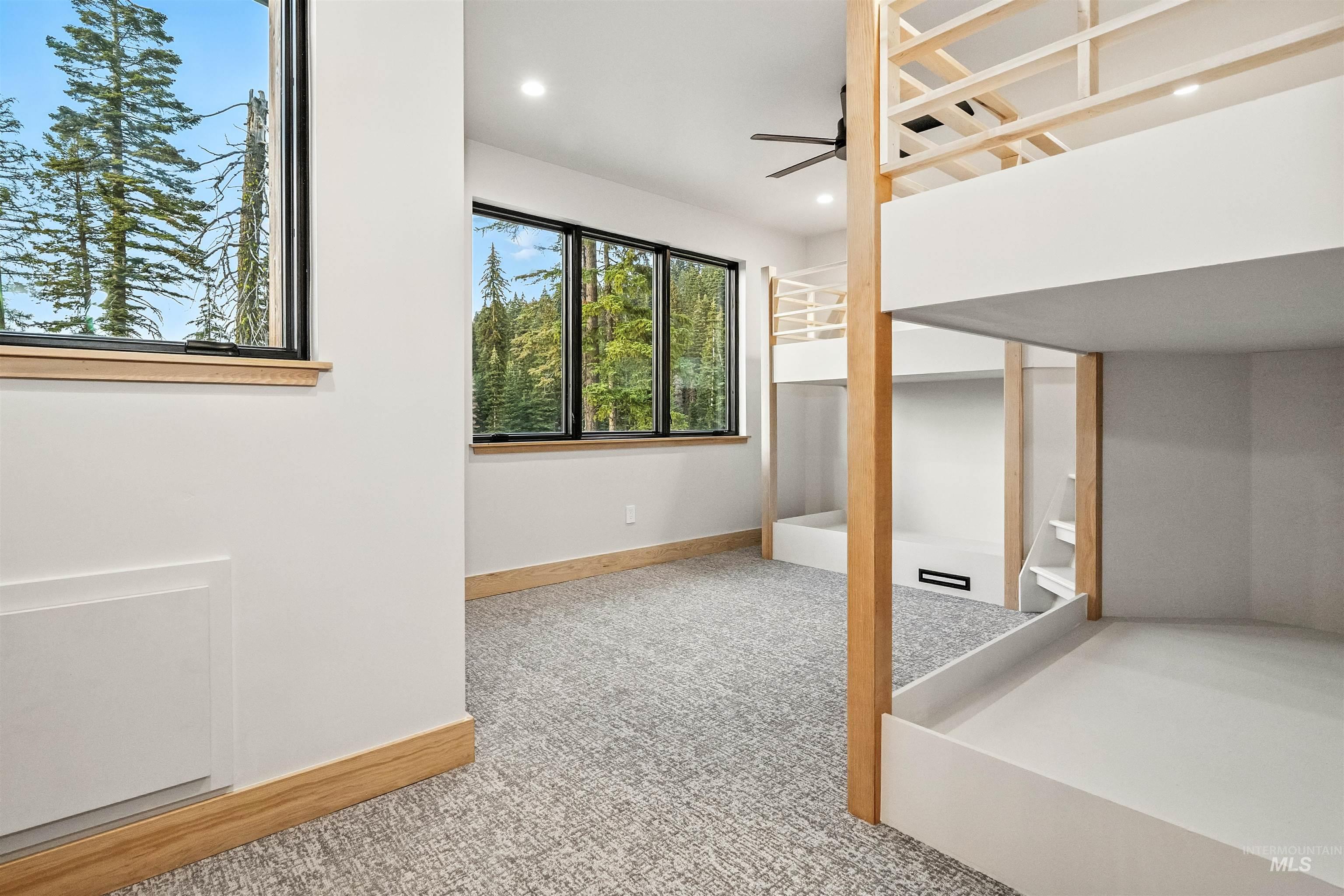 Unfurnished bedroom featuring light carpet, recessed lighting, and ceiling fan