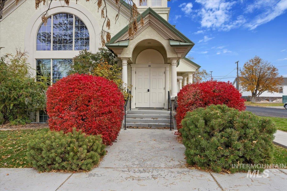 Entrance to property with stucco siding