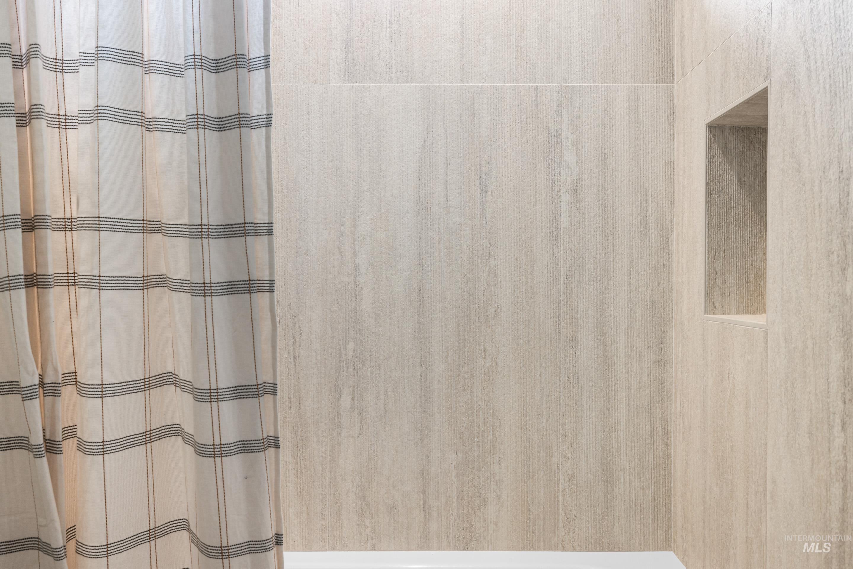 Bathroom with curtained shower