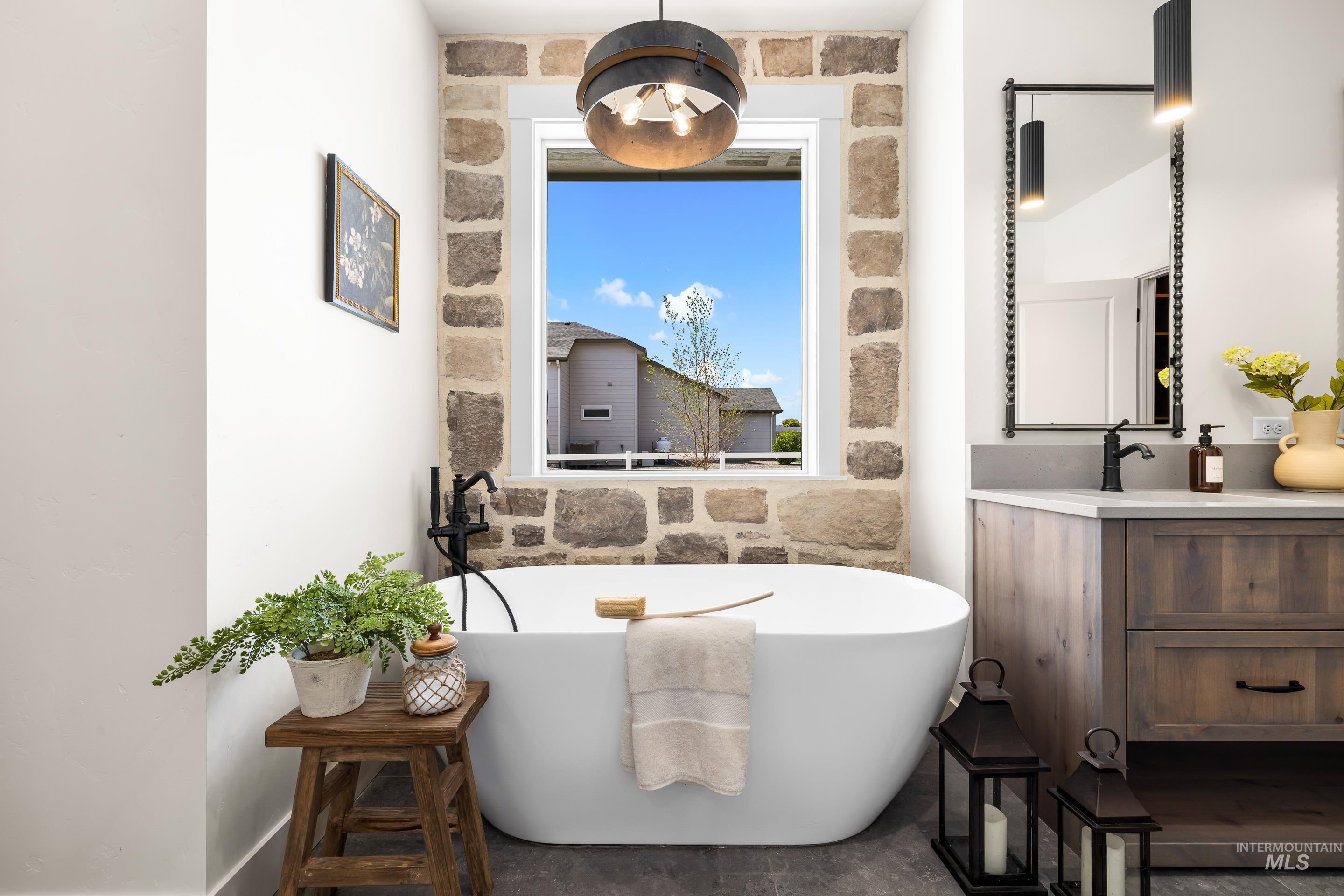Bathroom with vanity and a soaking tub