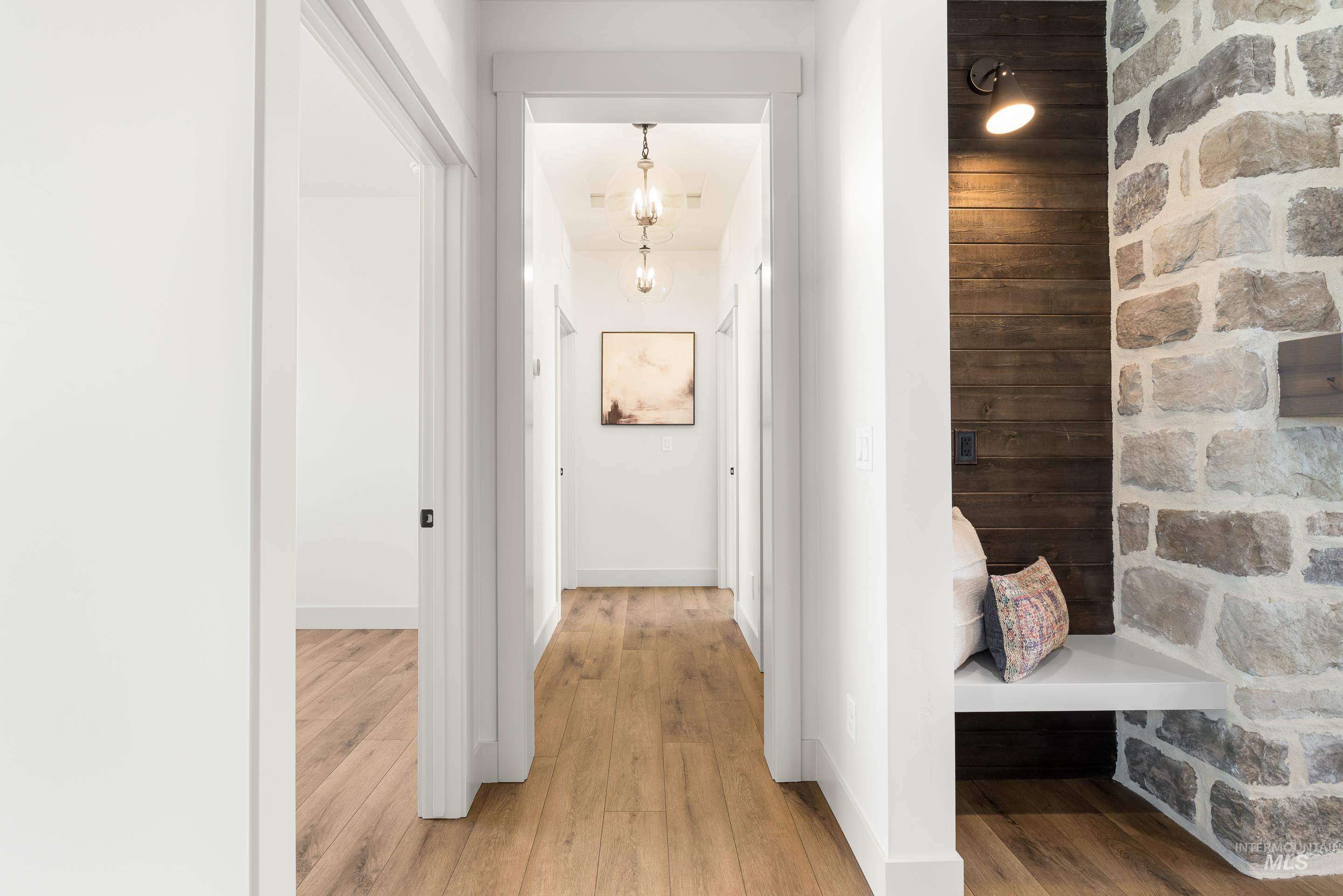 Corridor featuring light wood-style flooring