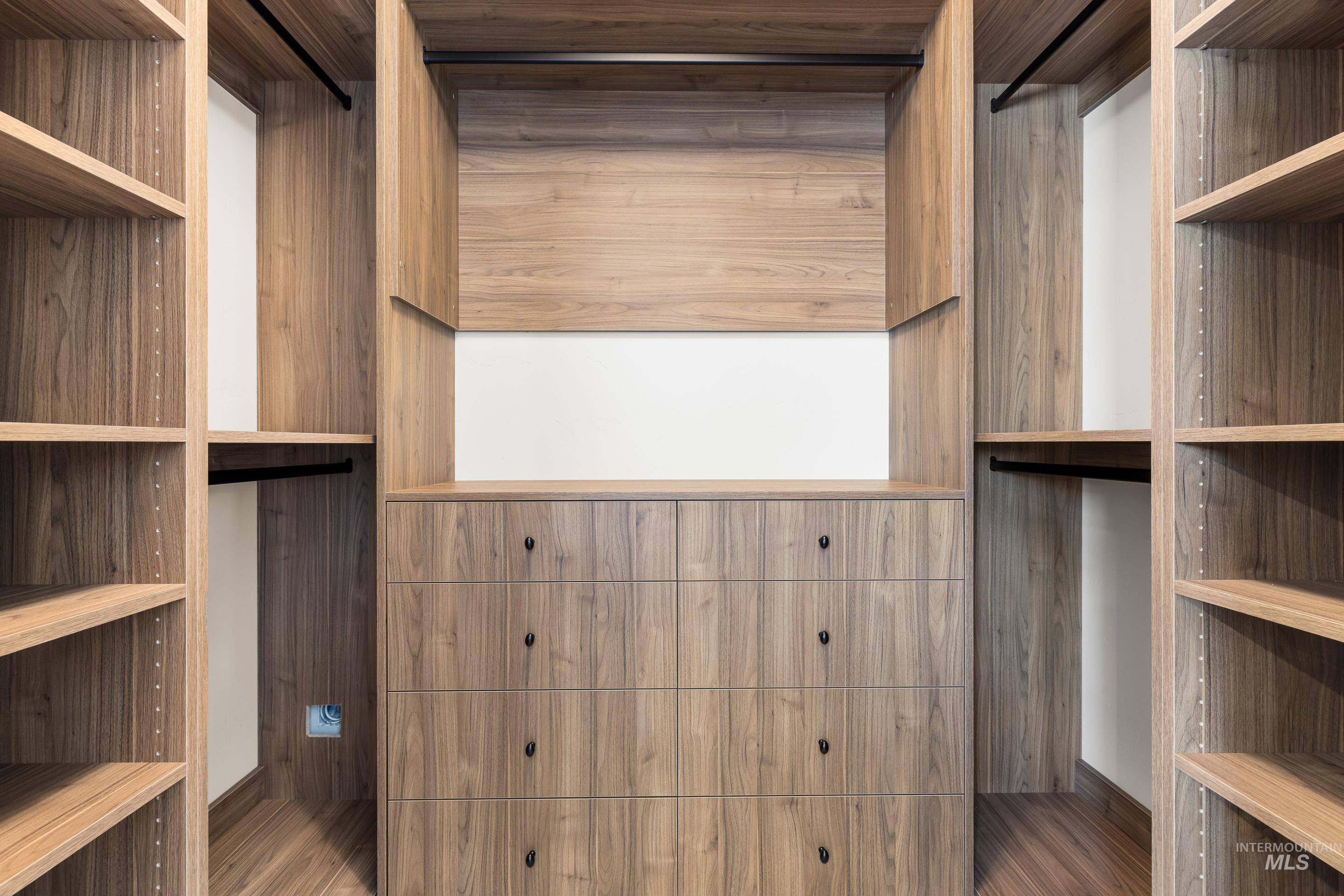 Spacious closet featuring wood finished floors