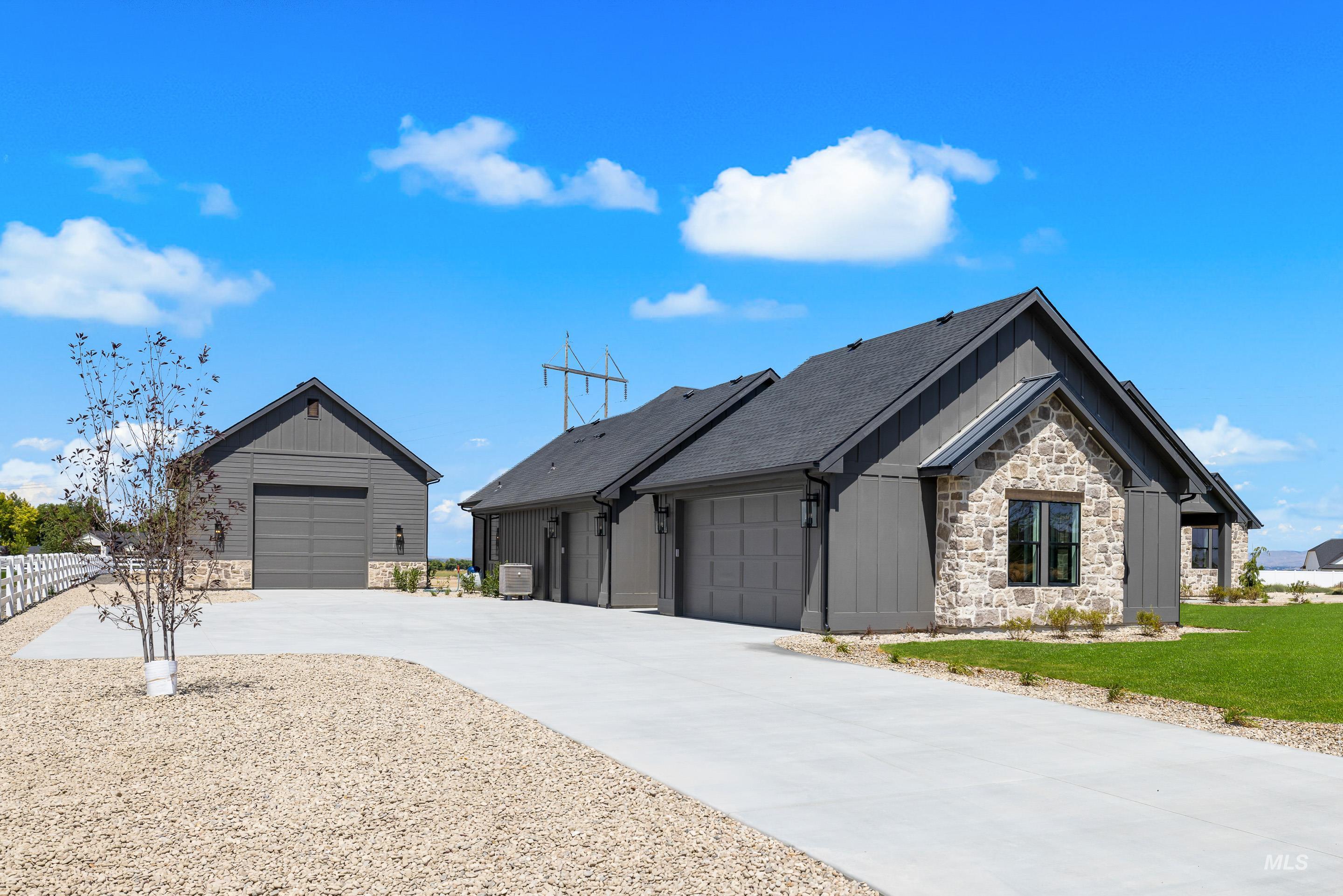 View of front of property with stone siding
