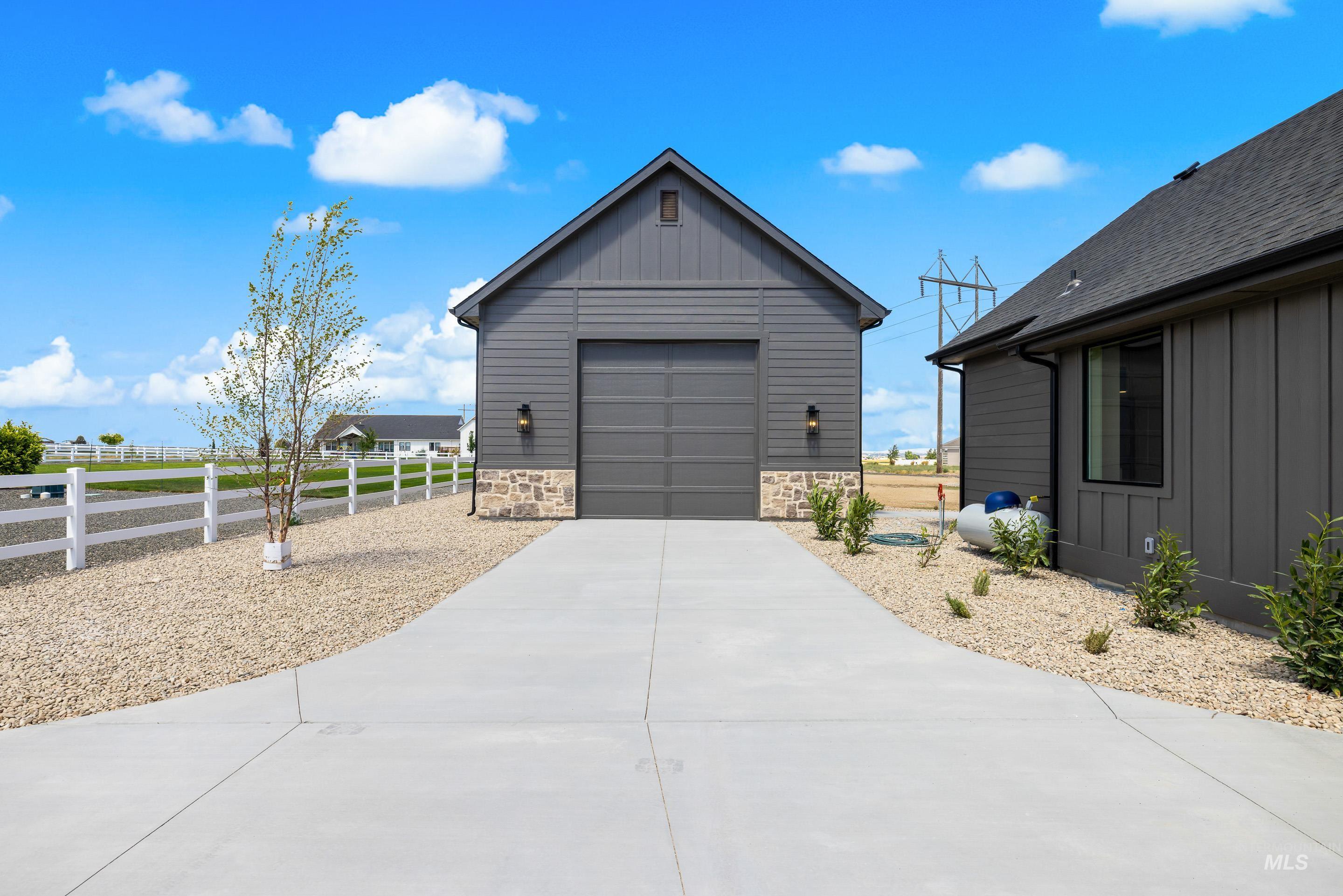 Garage featuring driveway