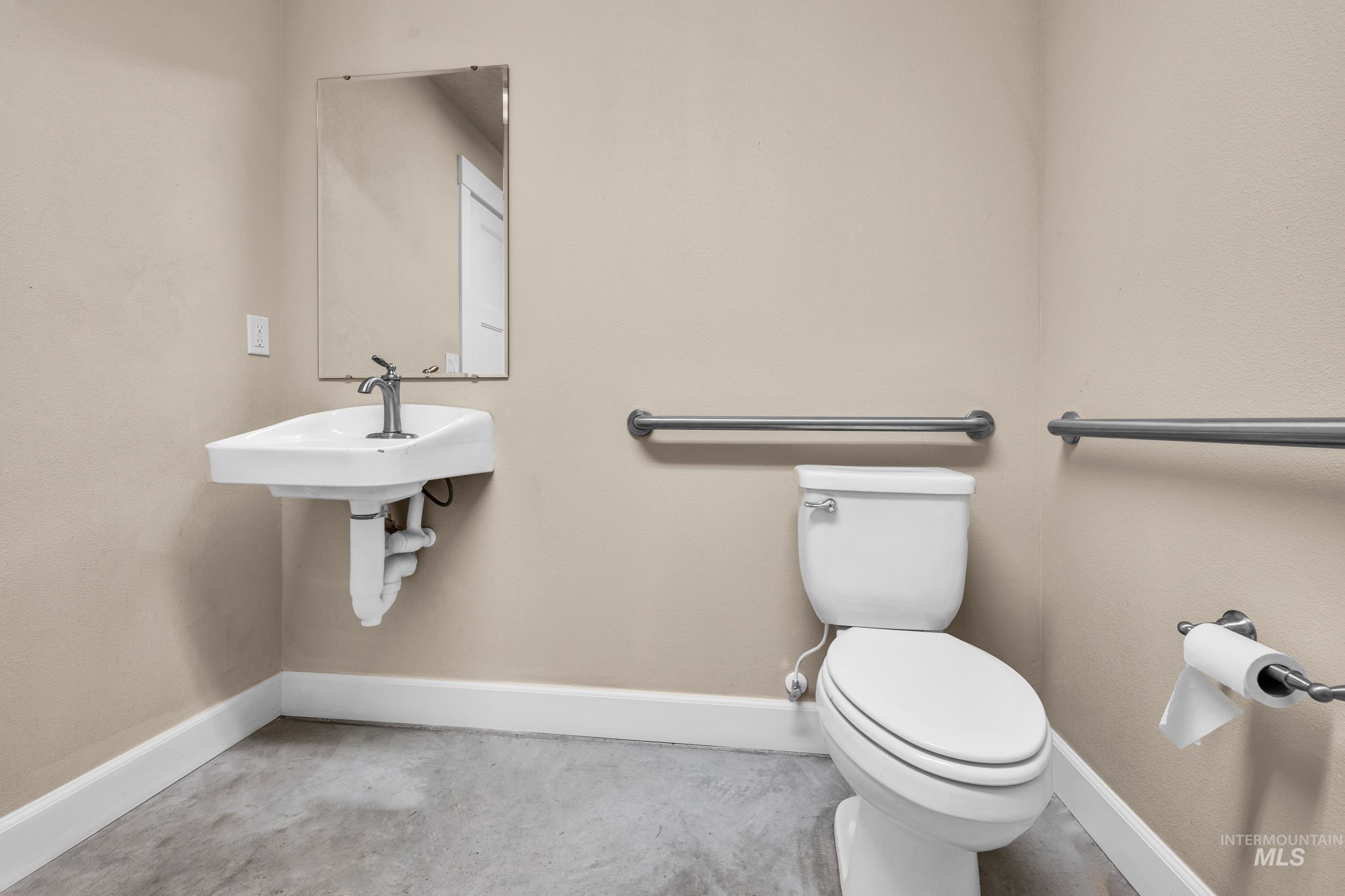 Bathroom with baseboards and toilet