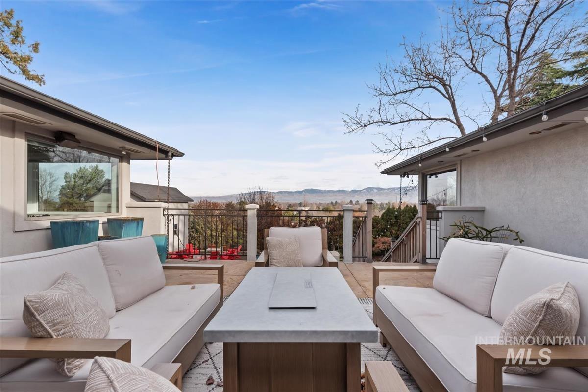 View of patio featuring an outdoor hangout area and a mountain view