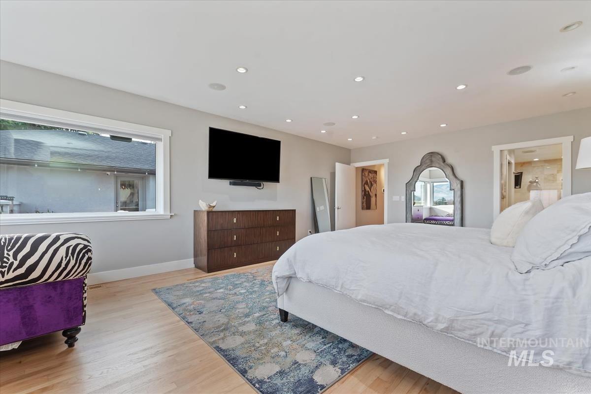 Bedroom featuring light wood-style flooring and recessed lighting