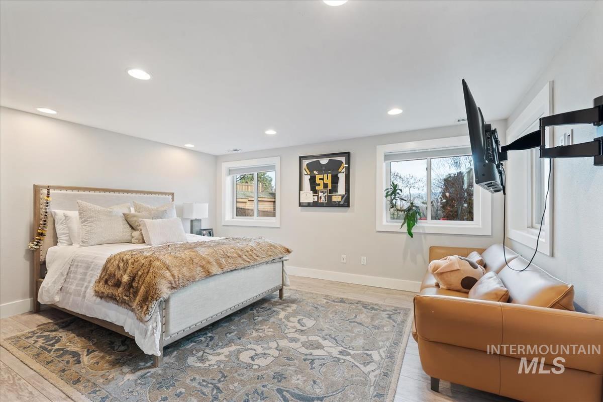 Bedroom with recessed lighting and baseboards
