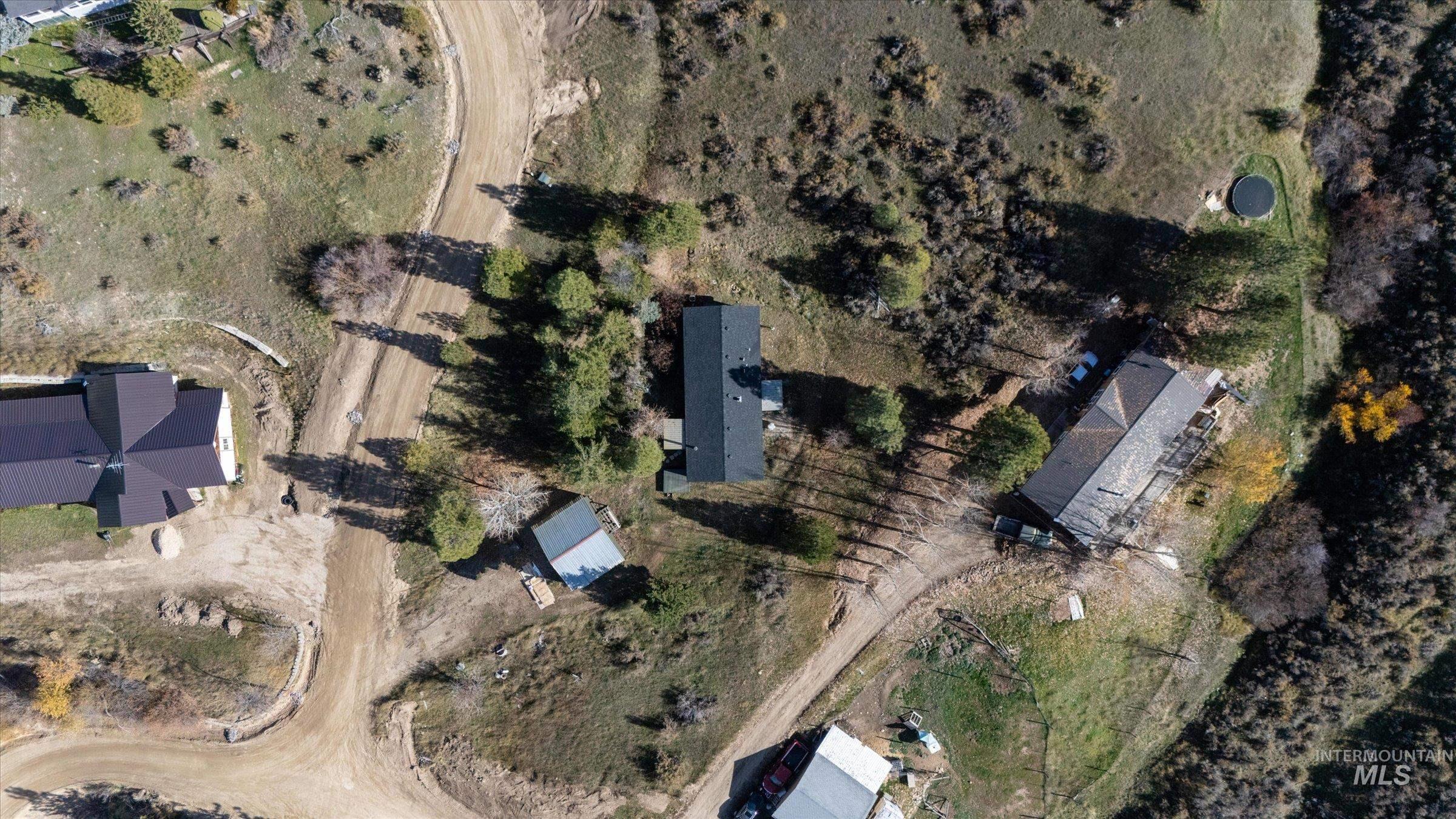 Aerial view of property and surrounding area with rural landscape