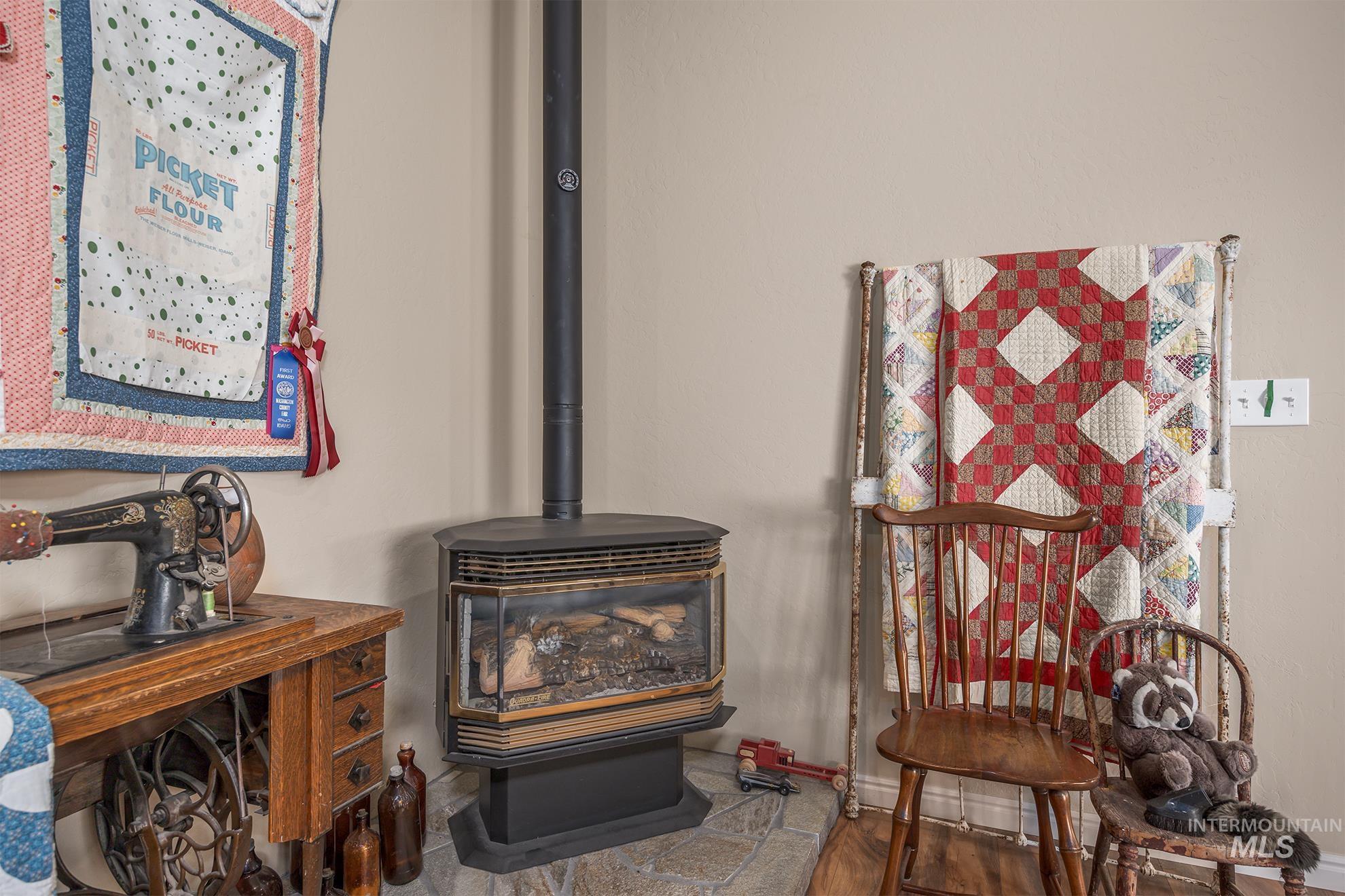 Detailed view of a wood stove and wood finished floors
