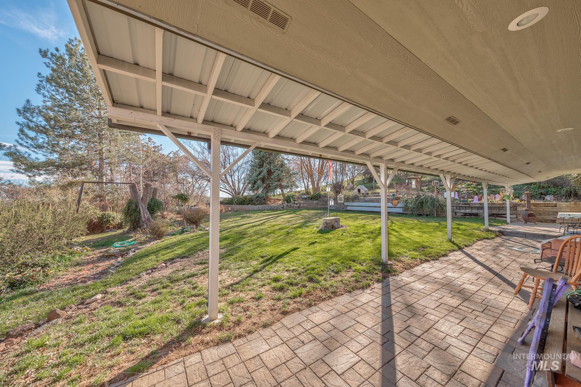 Fenced backyard with a patio area