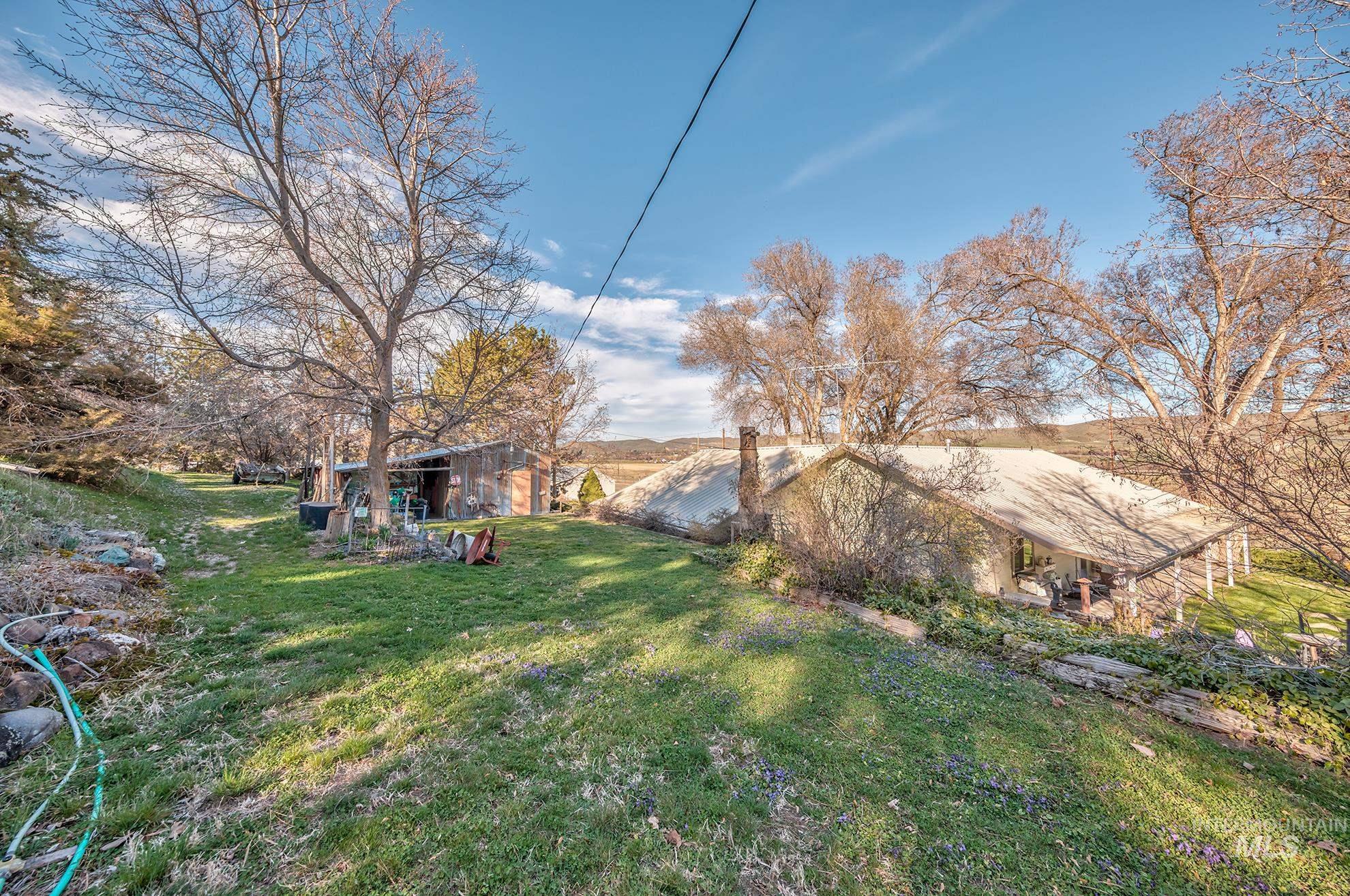 View of grassy yard with a patio