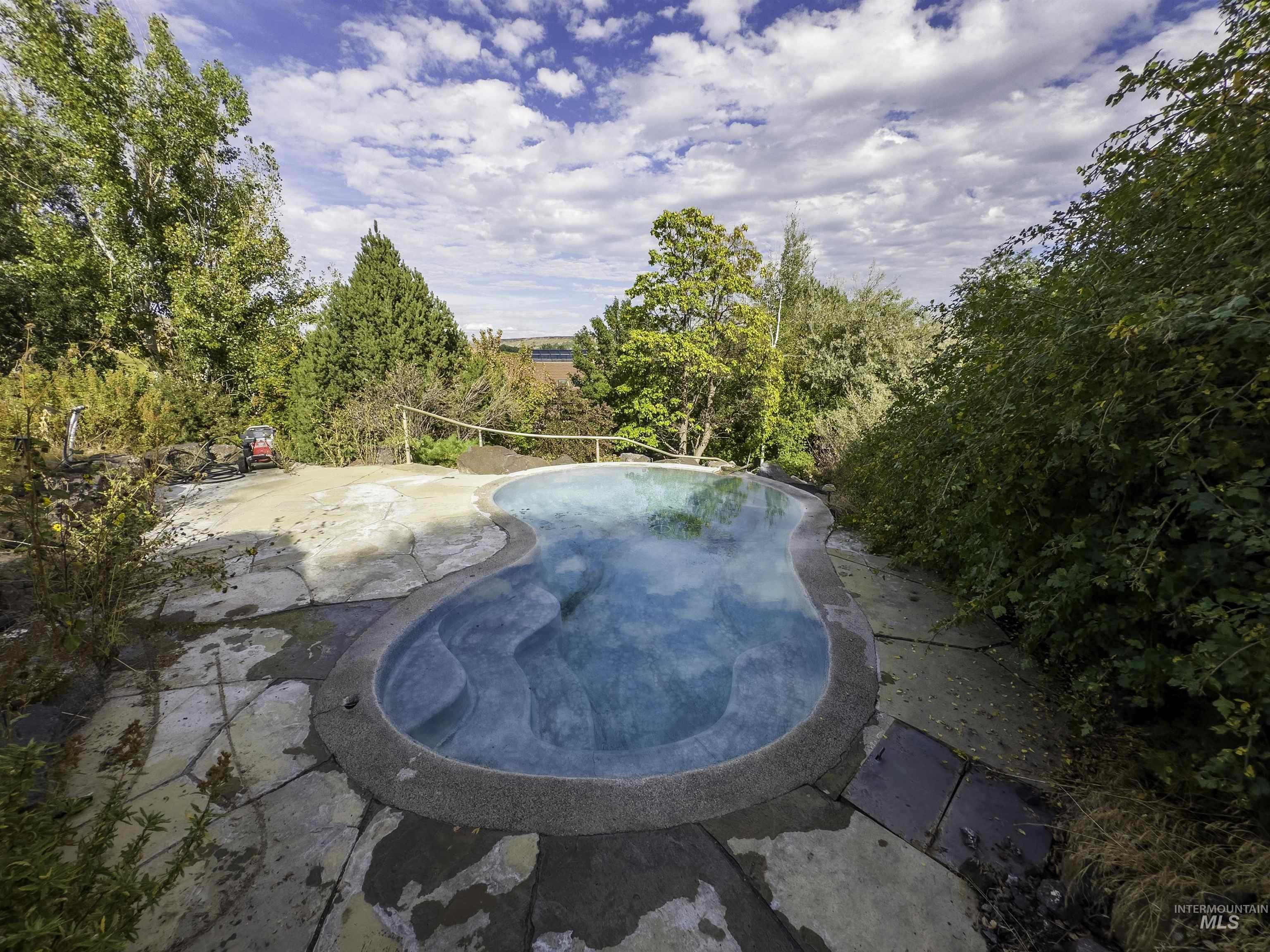Swimming pool with a patio