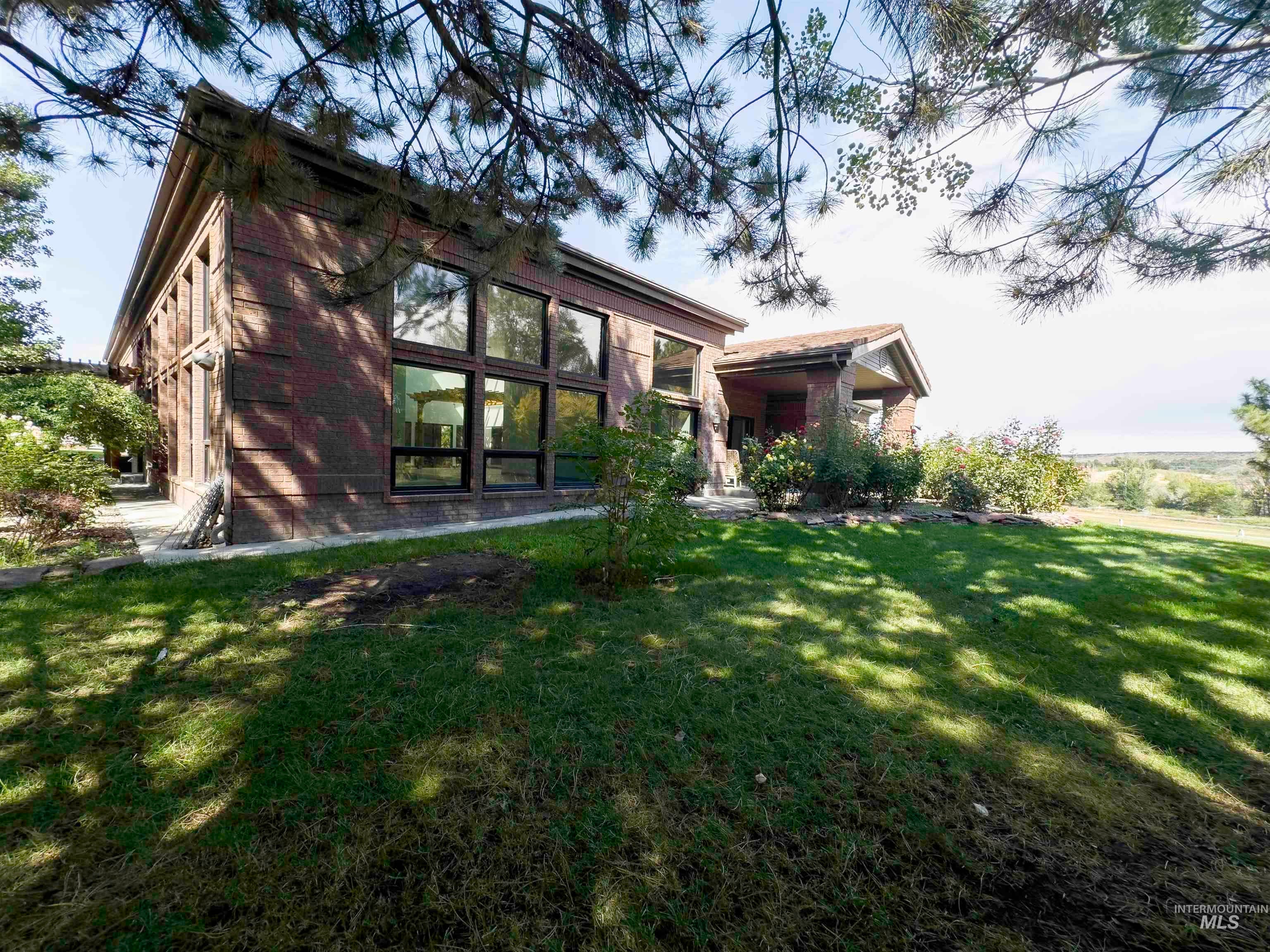 Back of house featuring a lawn