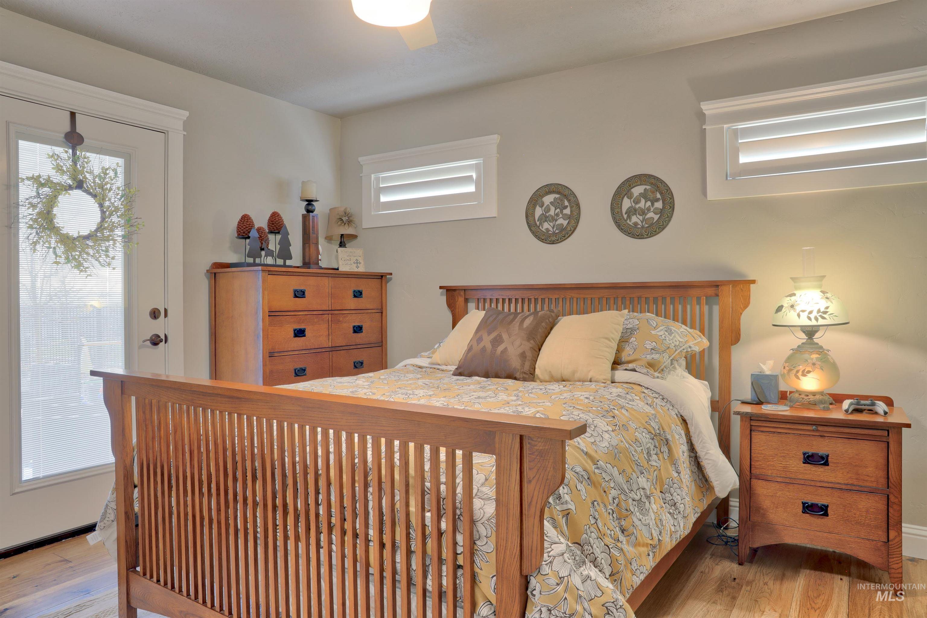 Bedroom featuring access to exterior and light wood-style flooring