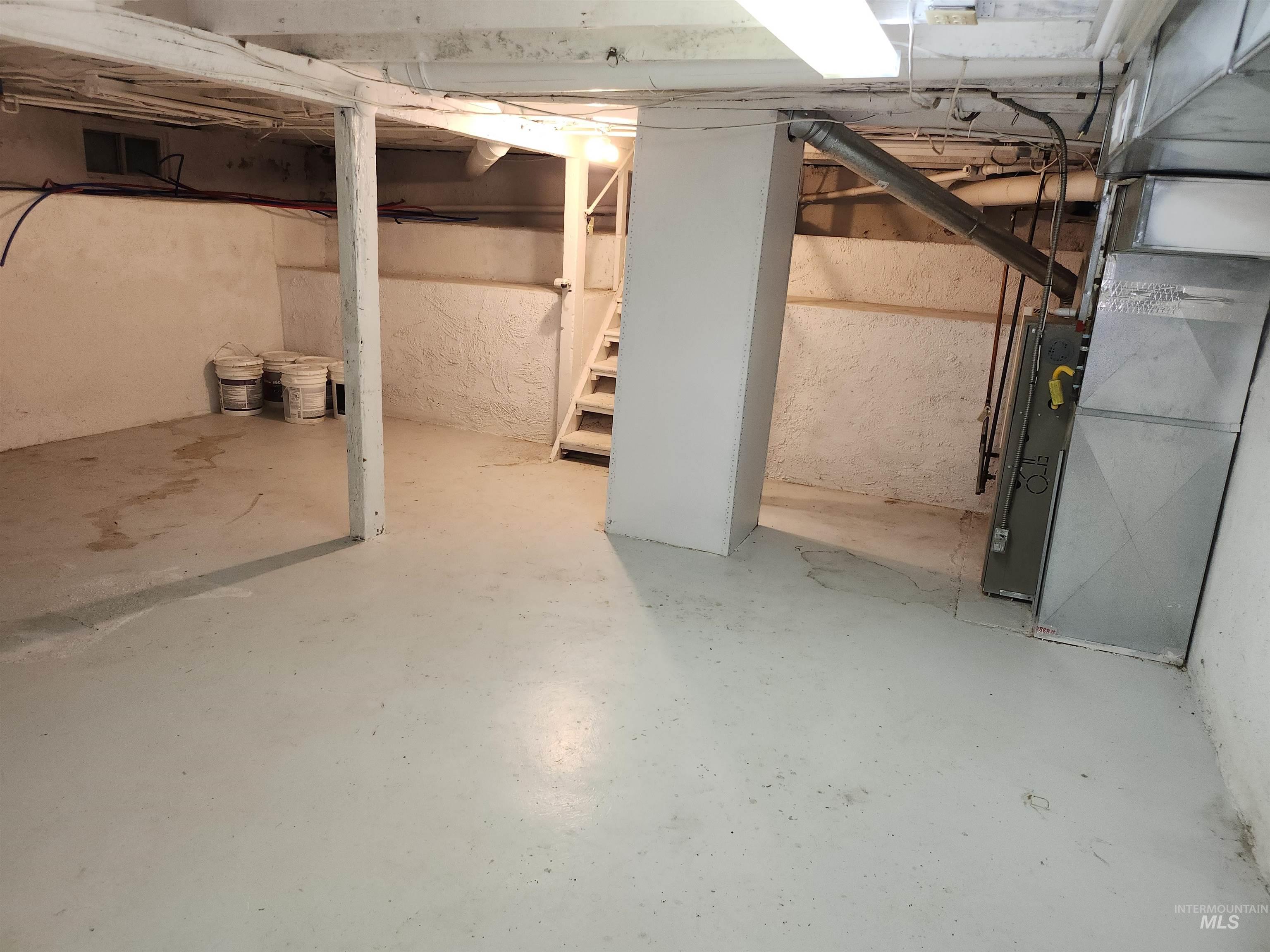 Unfinished basement with heating unit