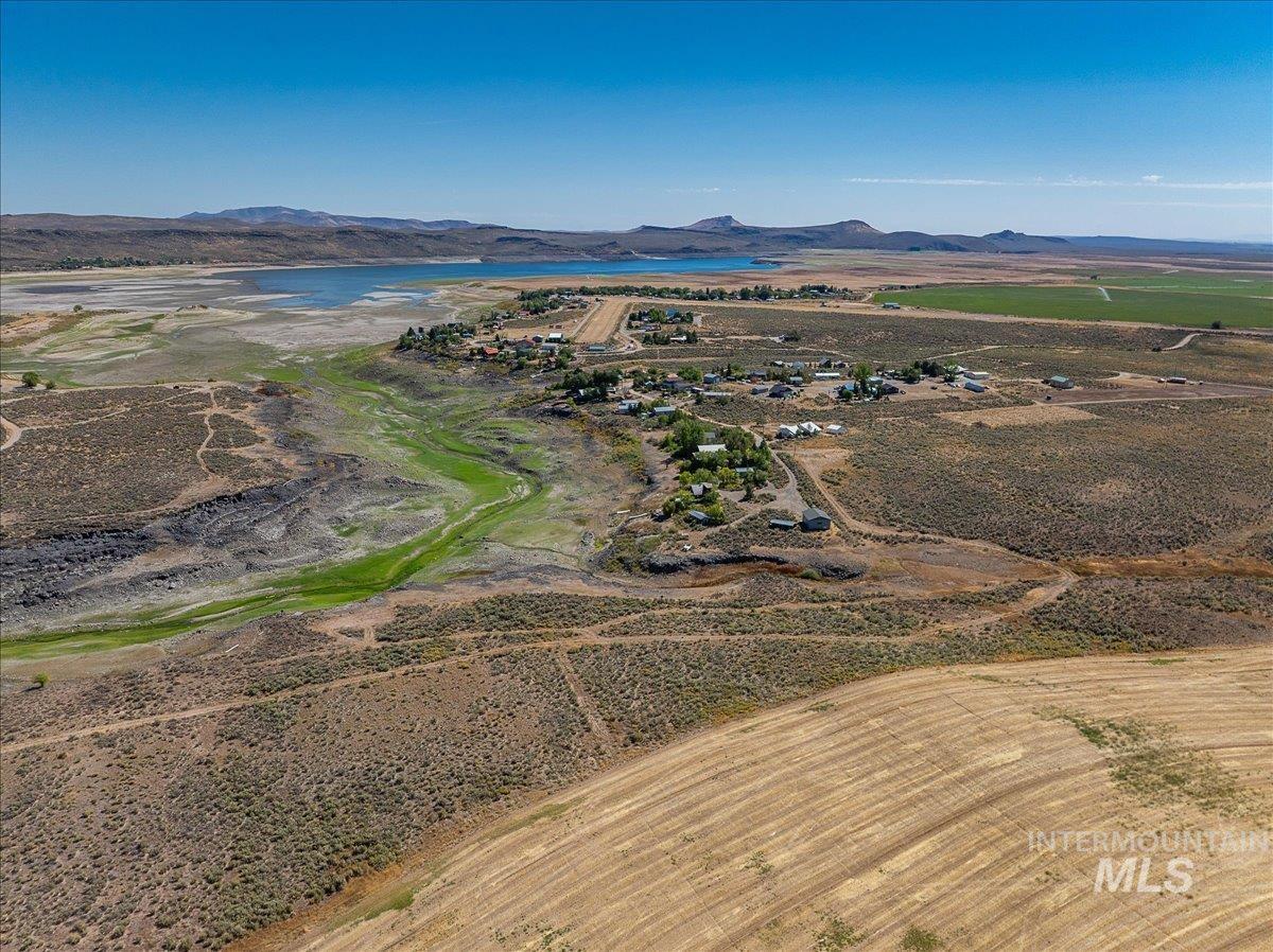 View of property location featuring a water and mountain view