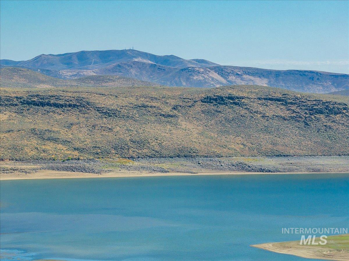 View of mountain backdrop with a large body of water