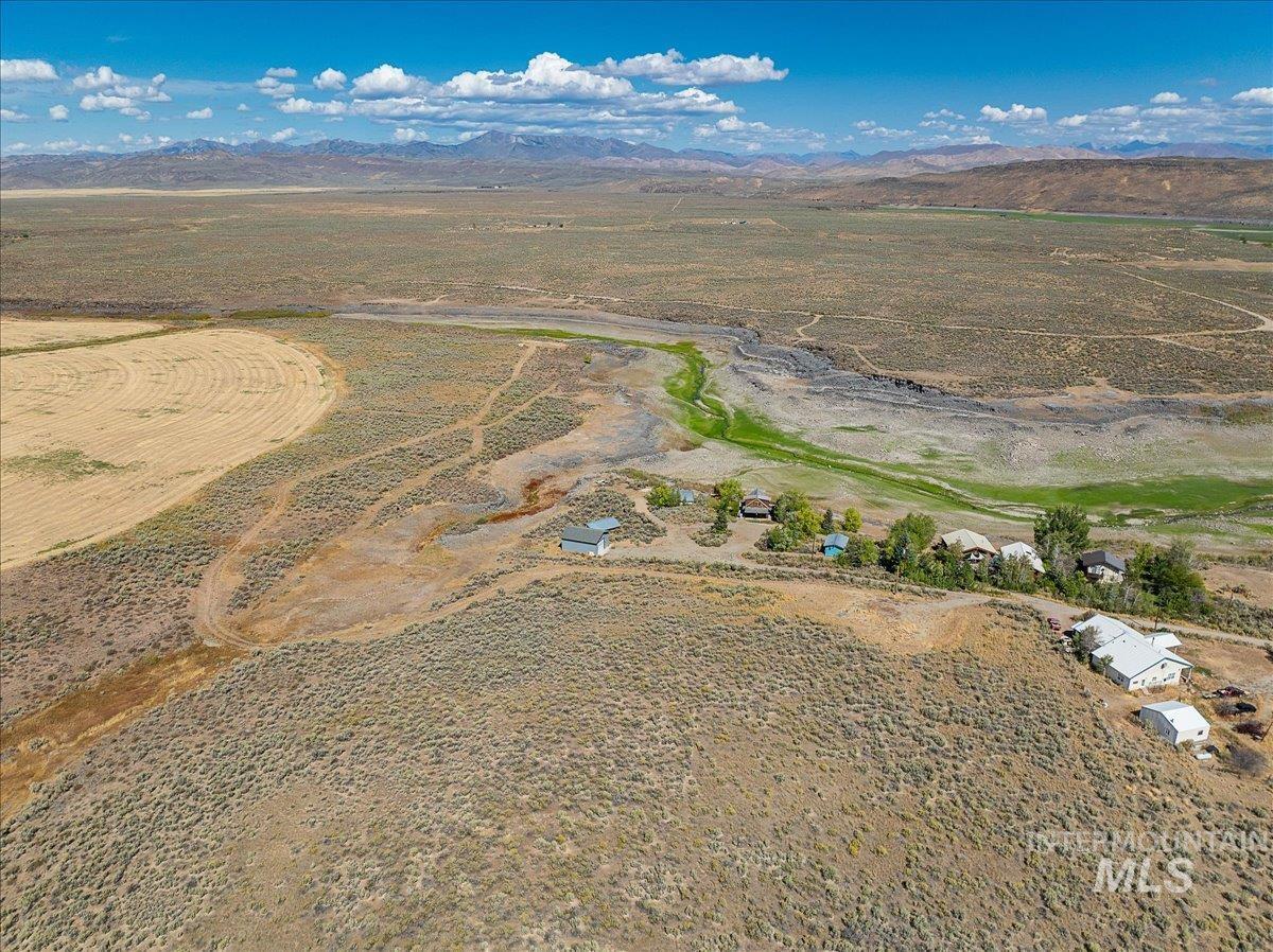 Overview of rural landscape featuring a mountainous background