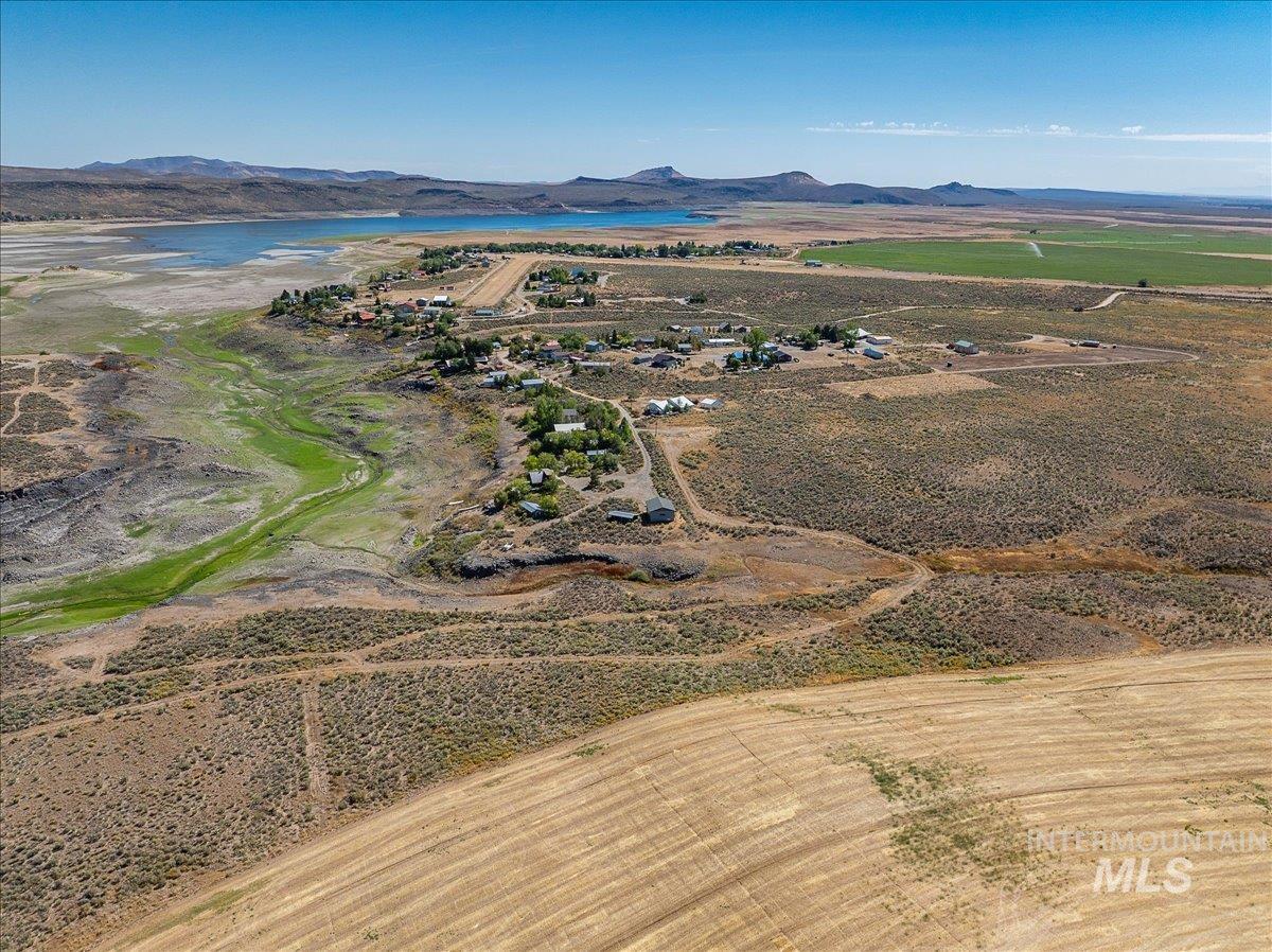 View of property location with a water and mountain view