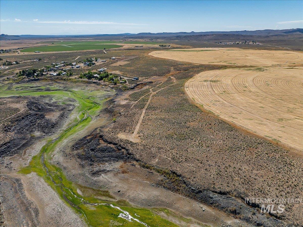 Aerial overview of property's location with mountains and rural landscape