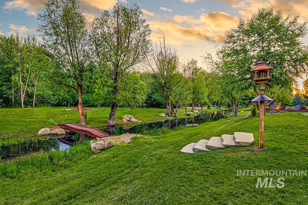 View of property's community featuring a yard