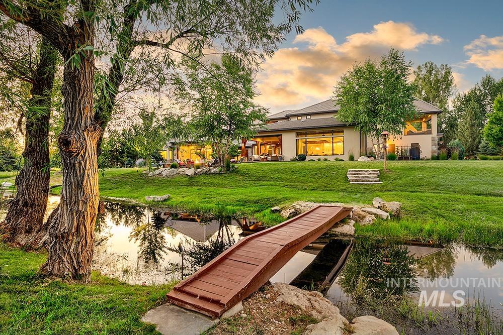 Yard at dusk with a yard and a water view