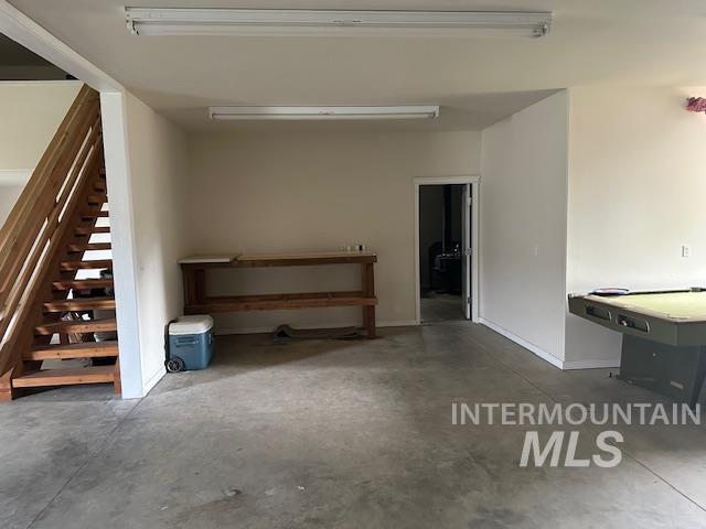 Garage featuring baseboards