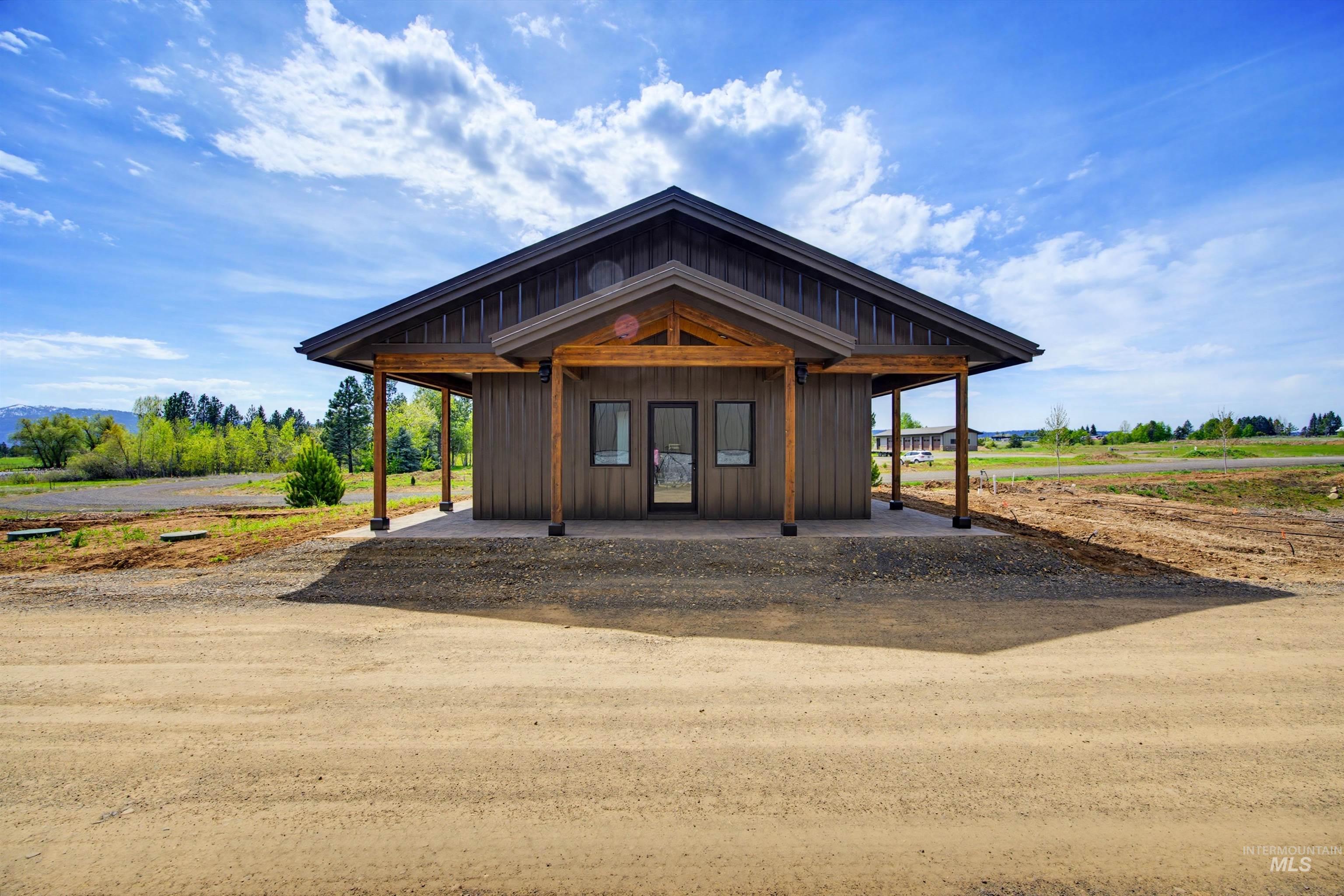 Exterior space with a porch and board and batten siding