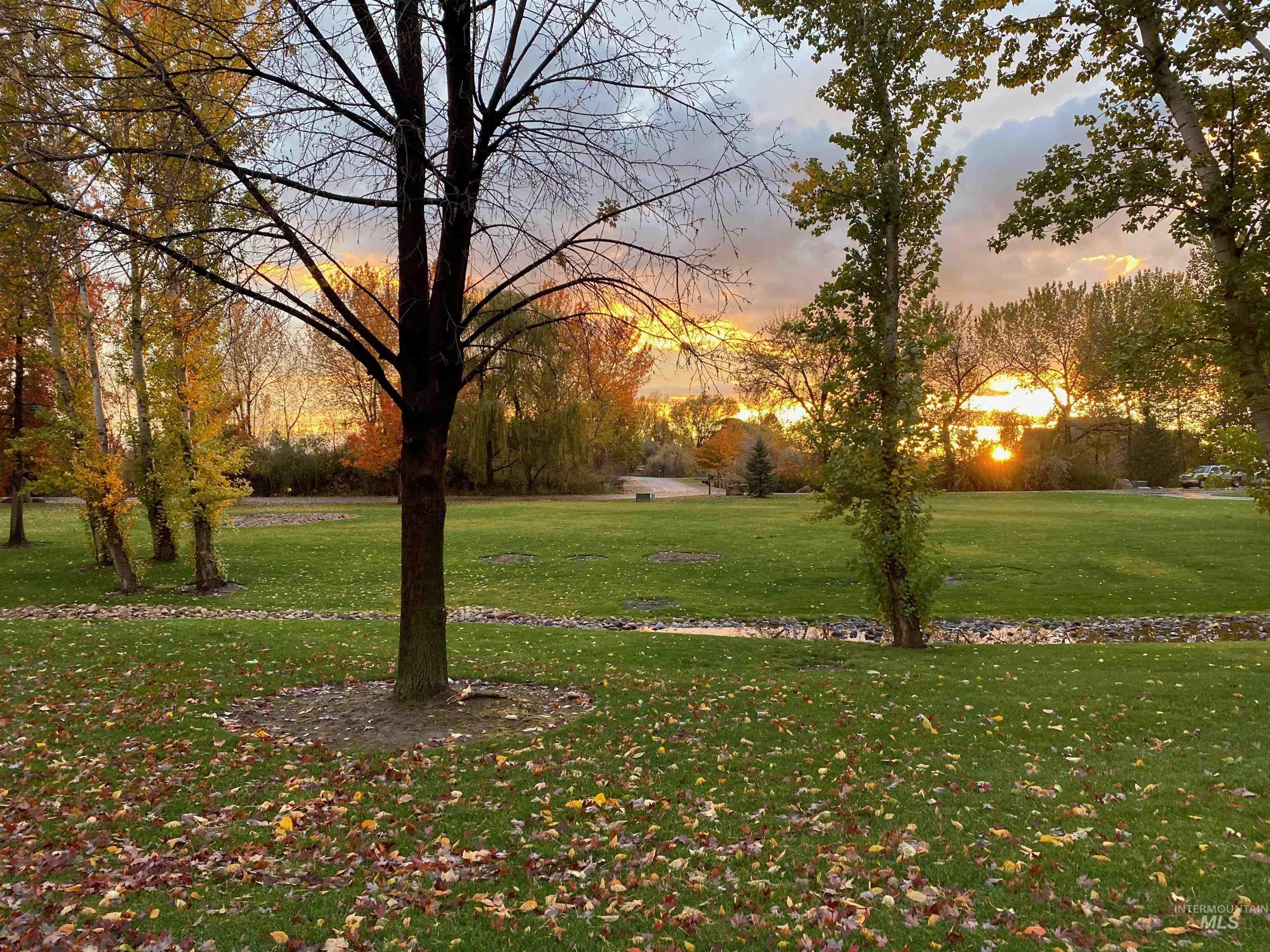 View of property's community featuring a lawn