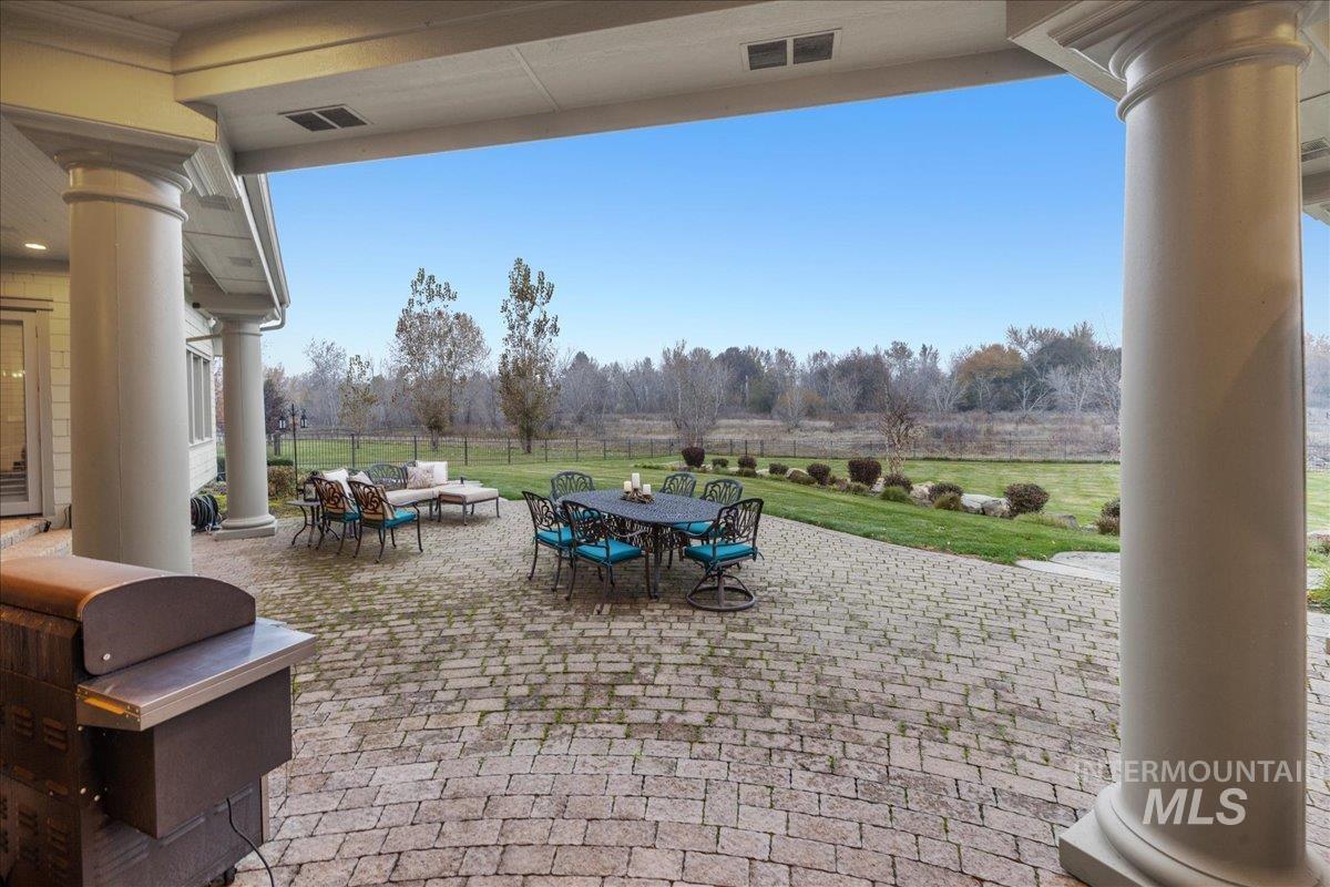 View of patio / terrace with outdoor dining area, outdoor lounge area, and view of scattered trees