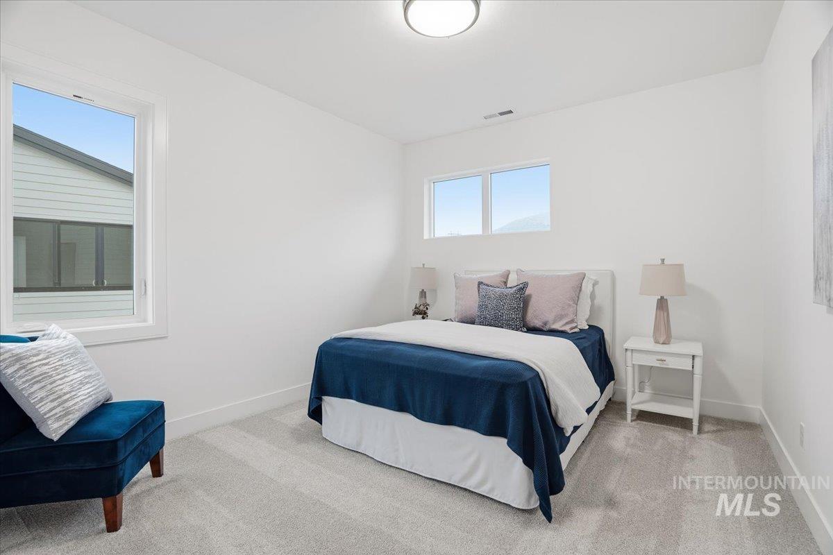 Bedroom with light carpet