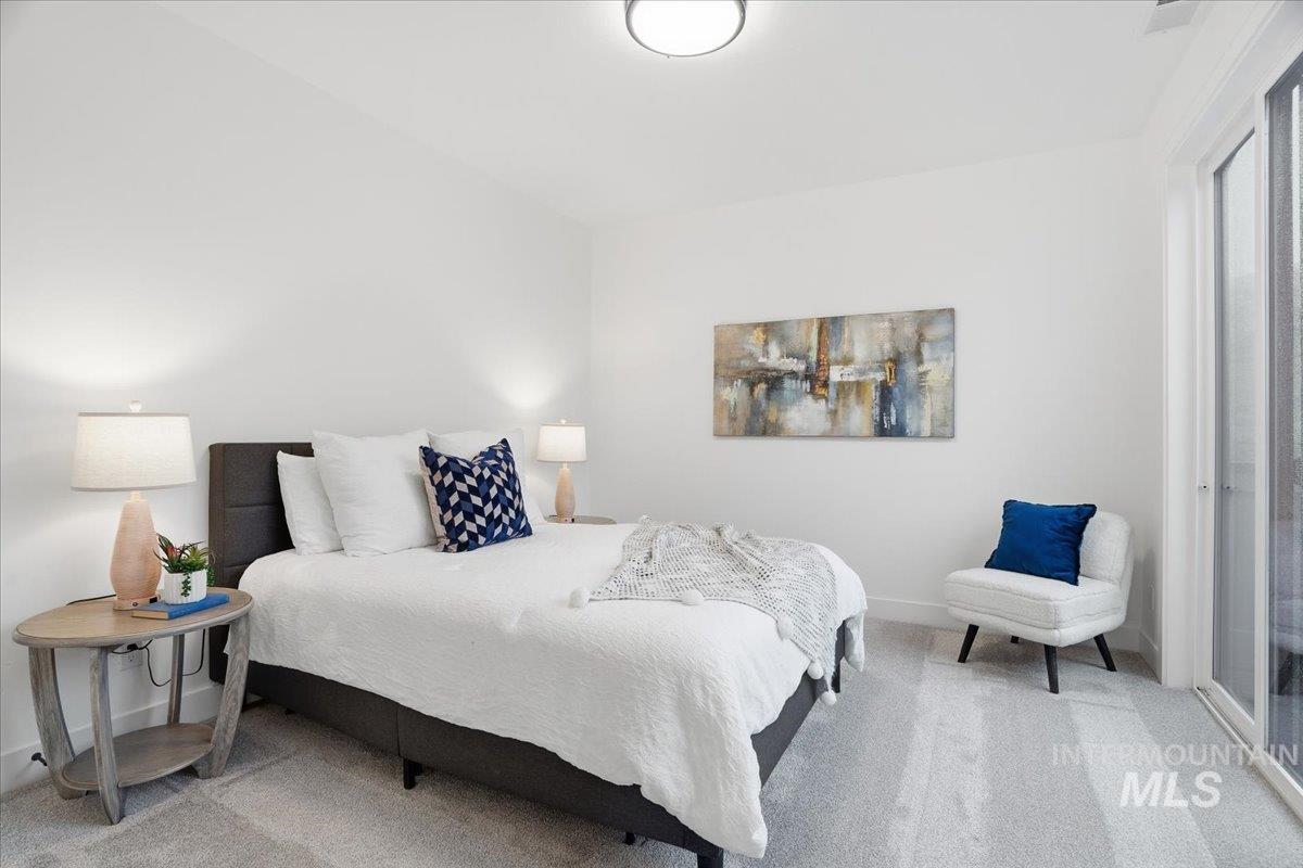 Carpeted bedroom with baseboards