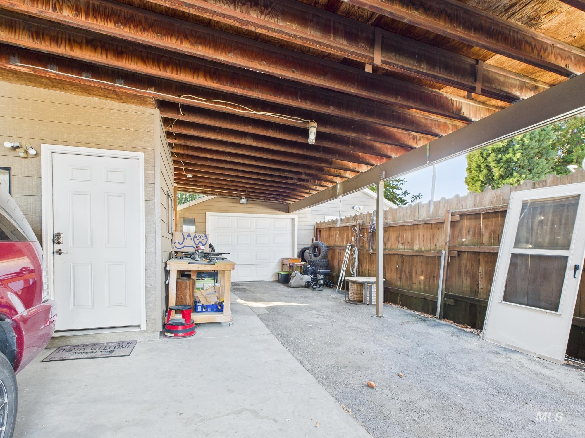 View of patio featuring a garage