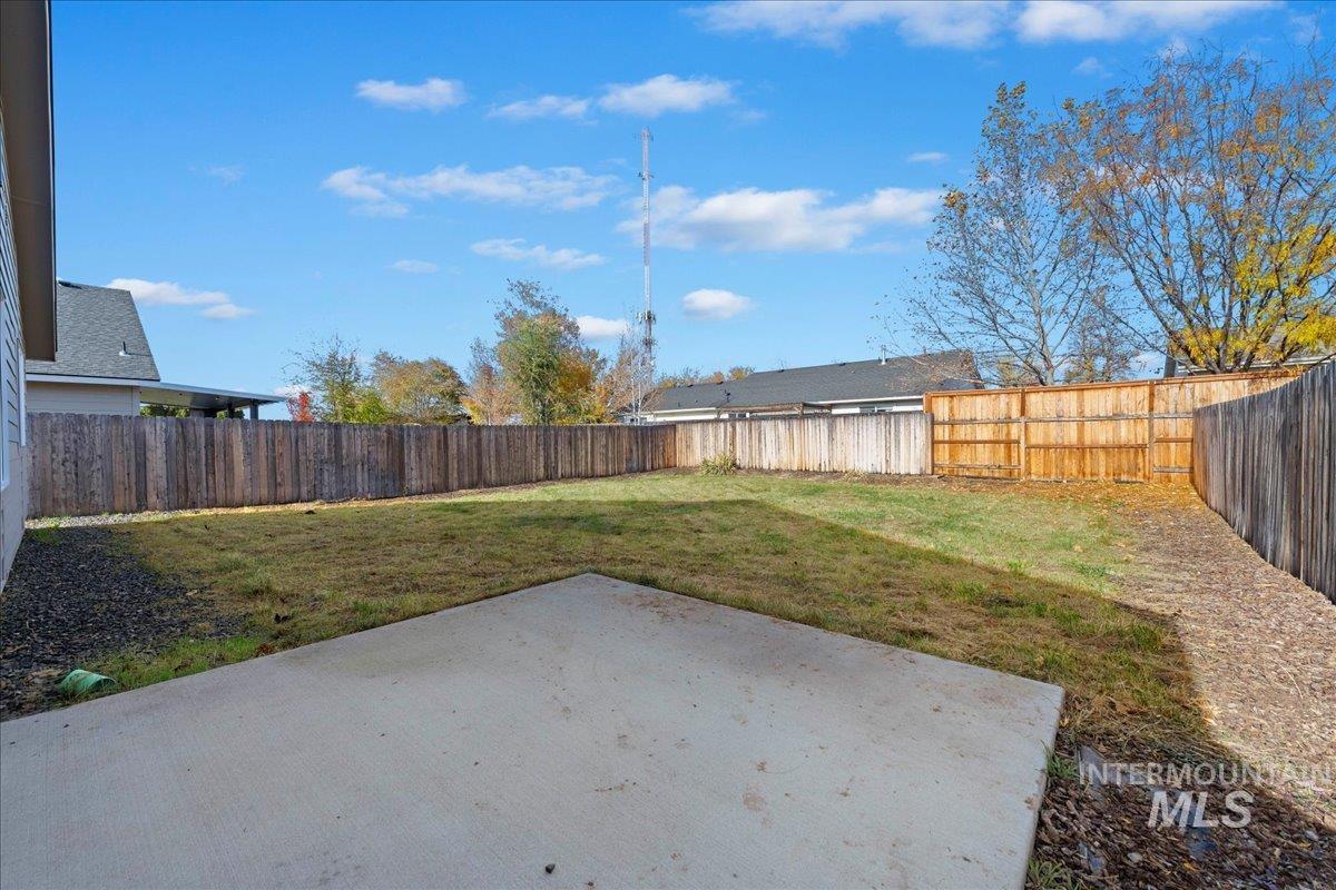 Fenced backyard with a patio area