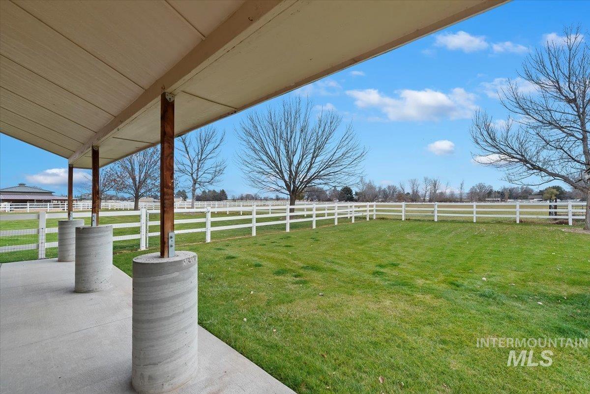 View of yard with a rural view