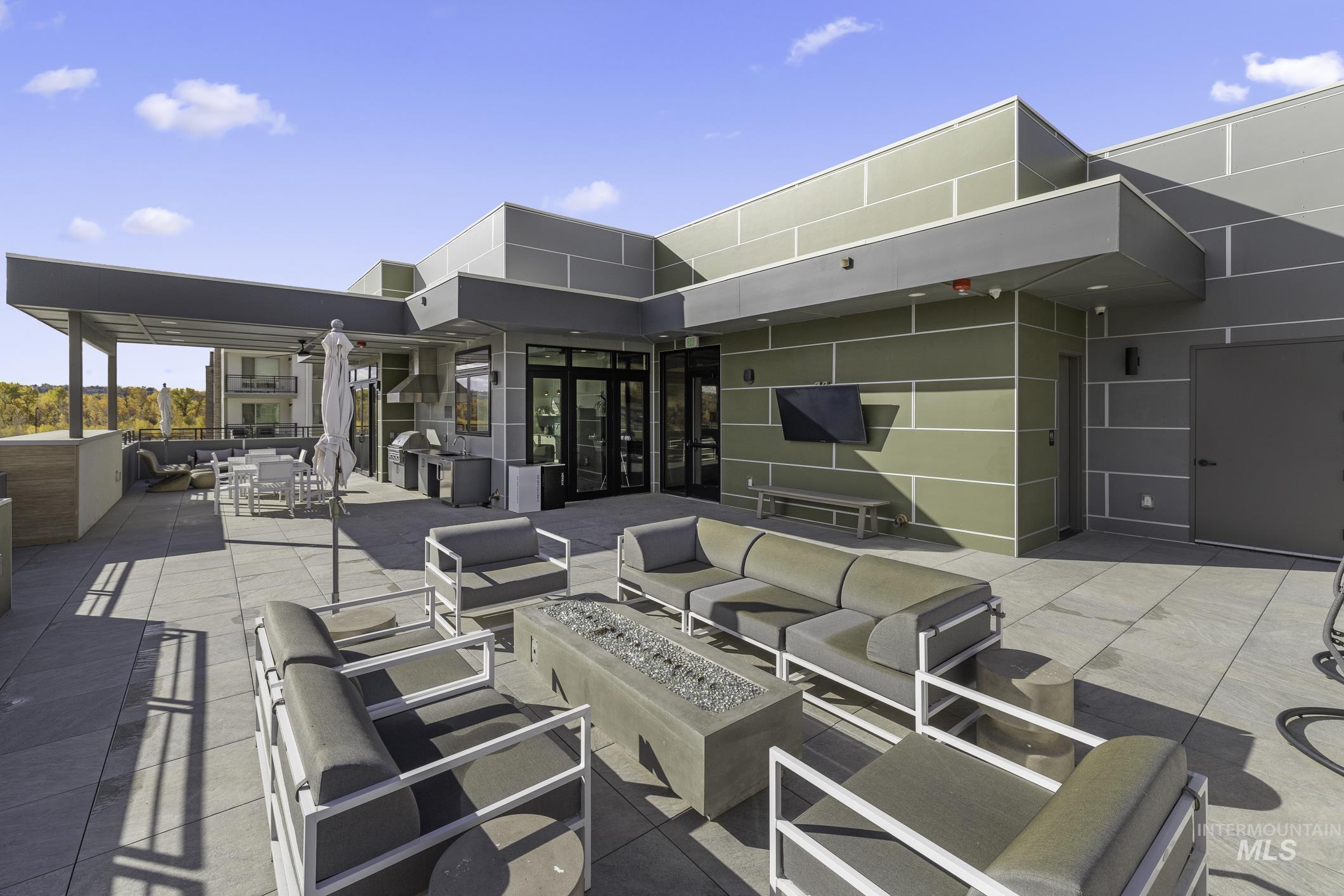 View of patio / terrace with an outdoor living space with a fire pit