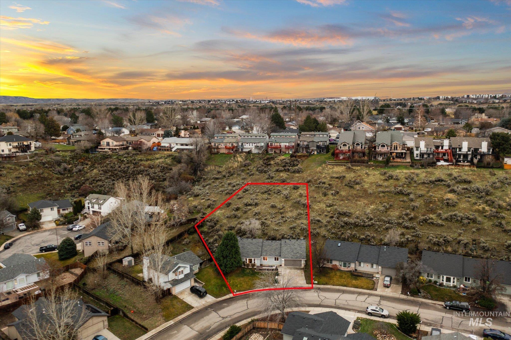 Aerial perspective of suburban area featuring property parcel outlined