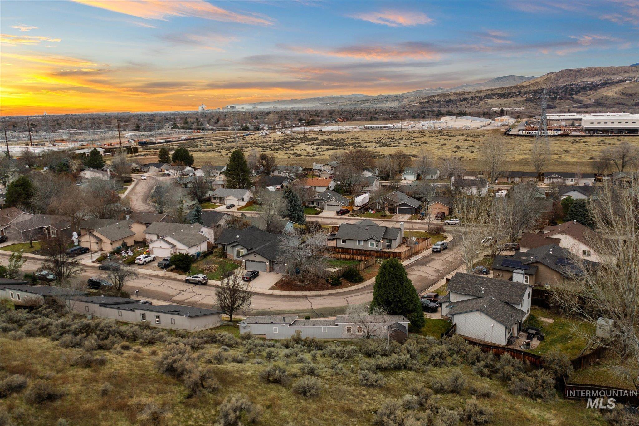 Aerial view at dusk of a residential view and a mountain view