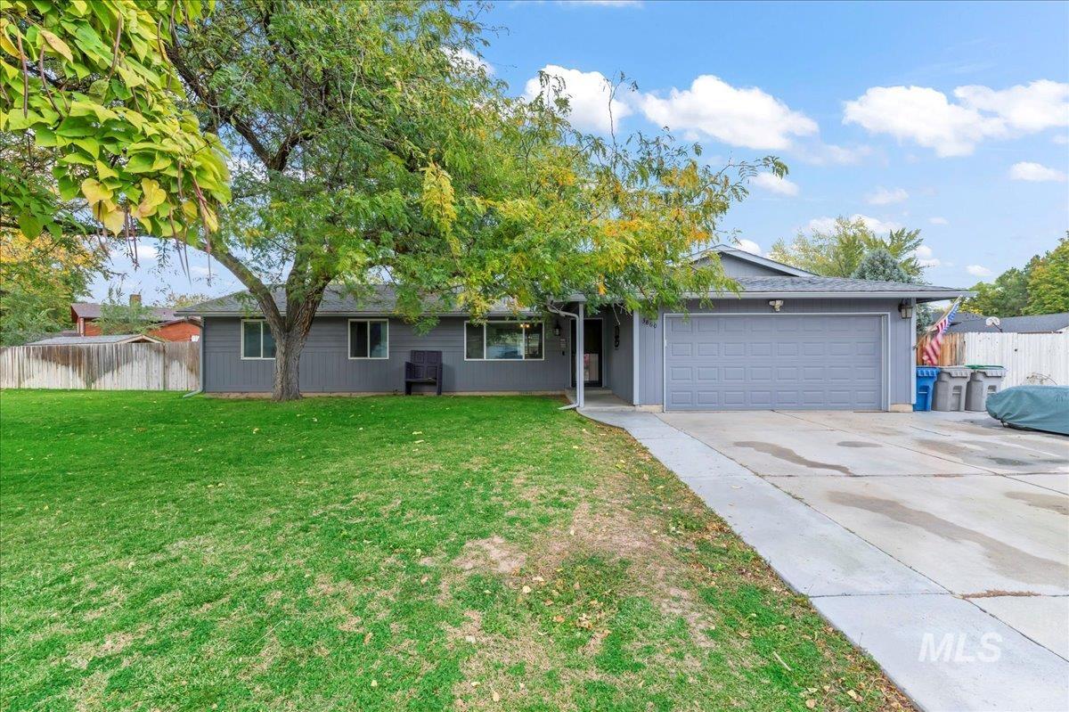 Ranch-style home with an attached garage and concrete driveway