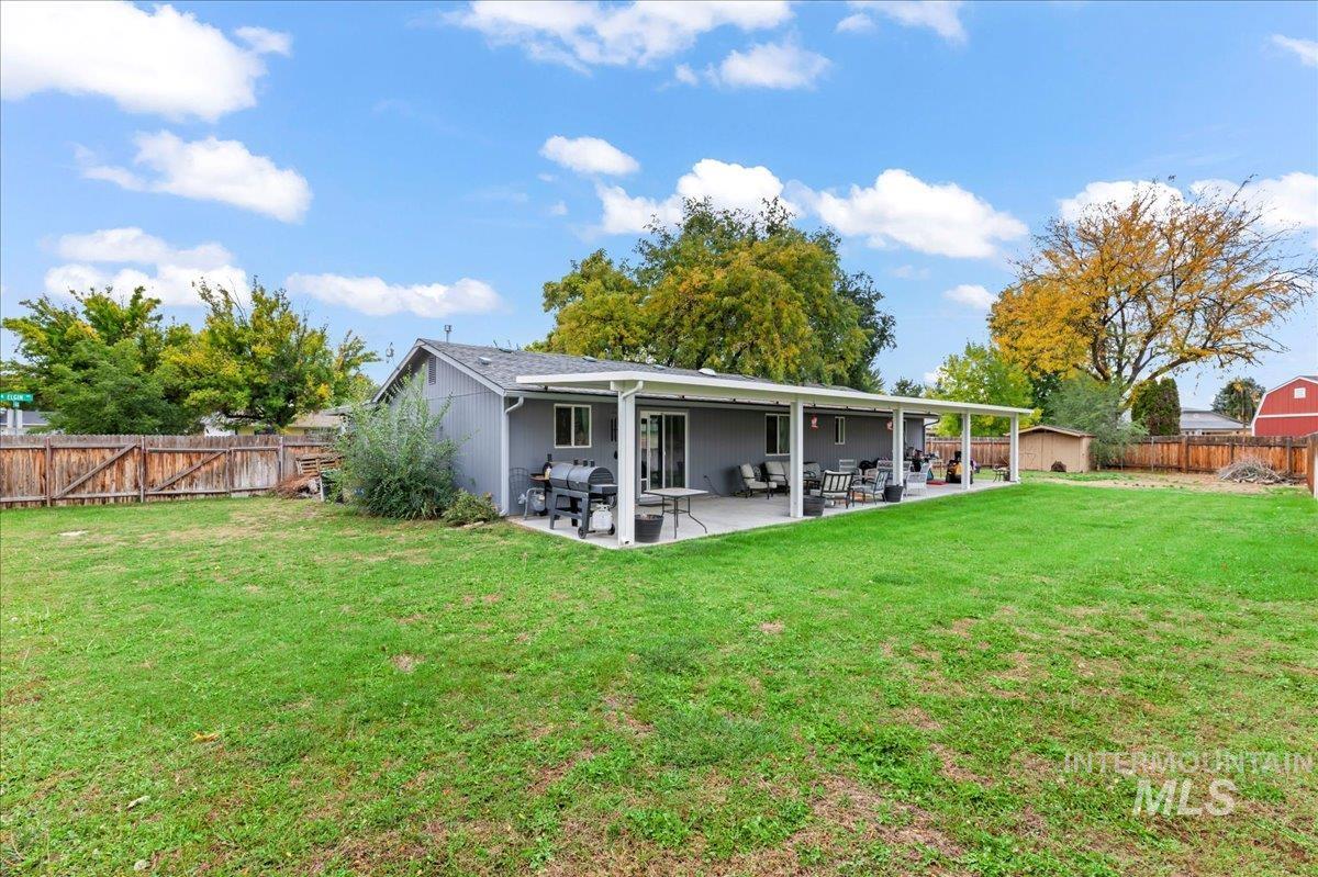 Back of house featuring a fenced backyard and a patio area