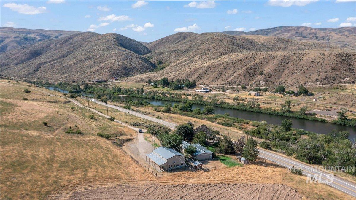 View of mountain background with river just accross the highway.